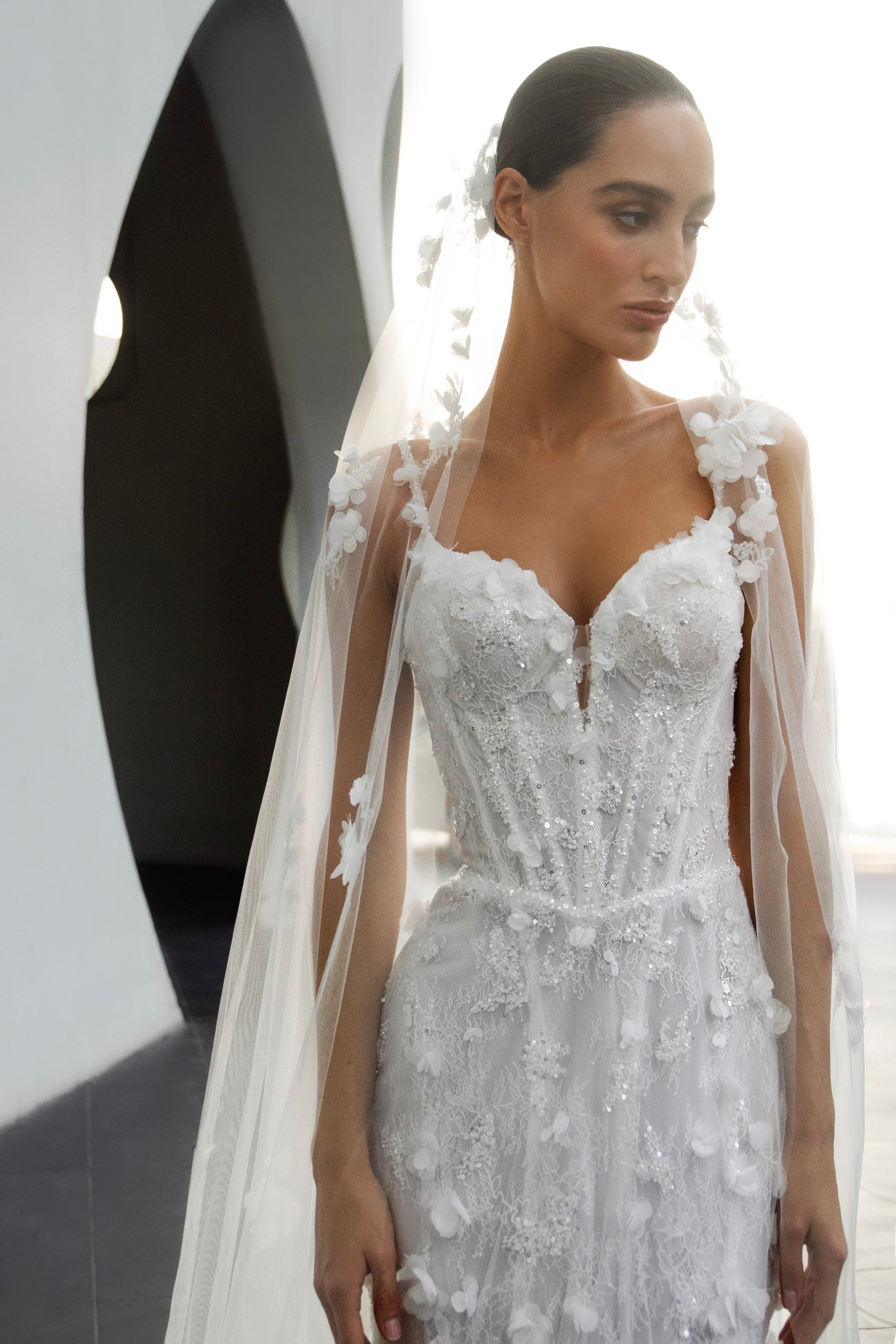 Bride wearing the Capri lace and tulle mermaid wedding gown from the Celeste Collection.