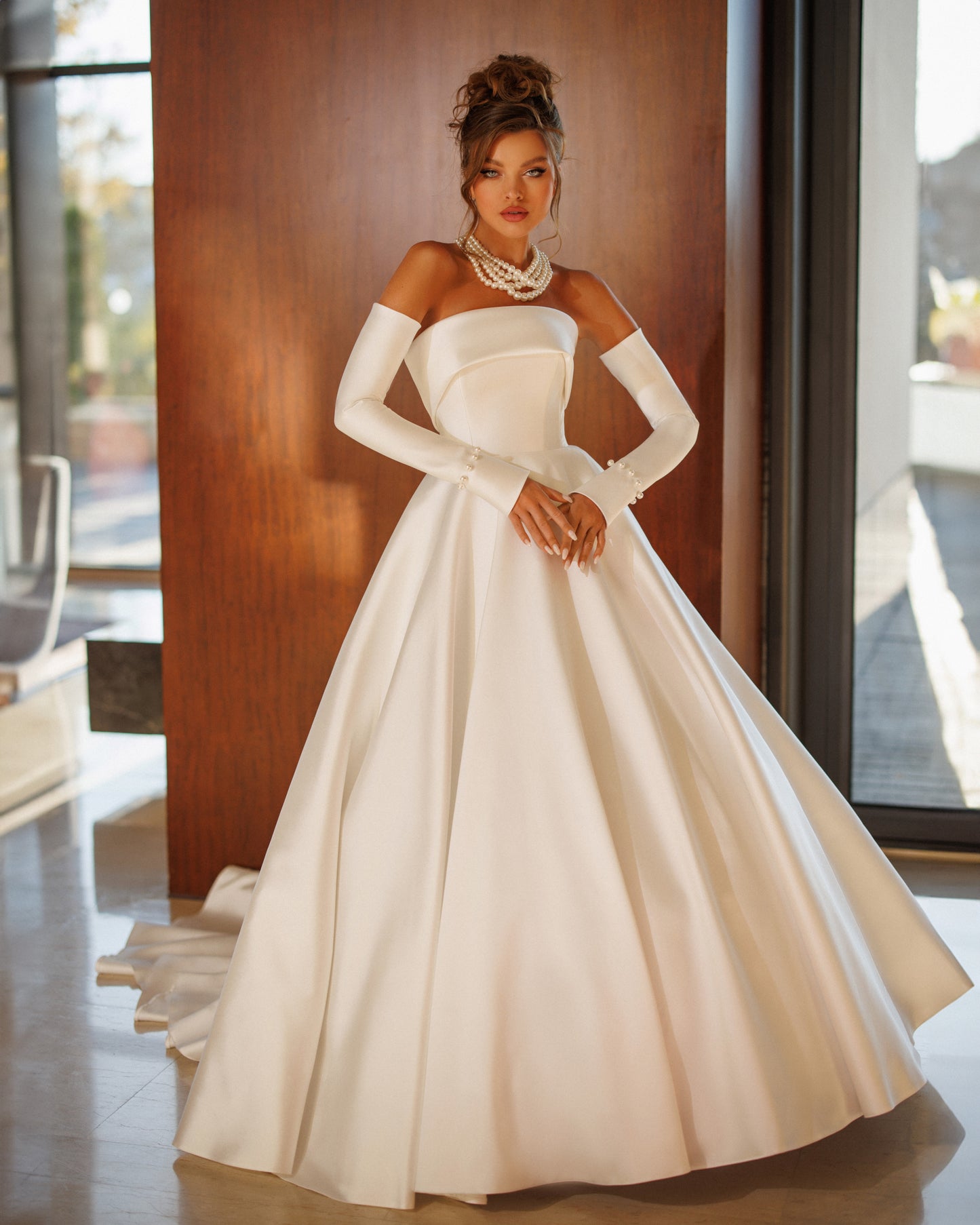 Princess A-line wedding dress with pearl slit sleeves.