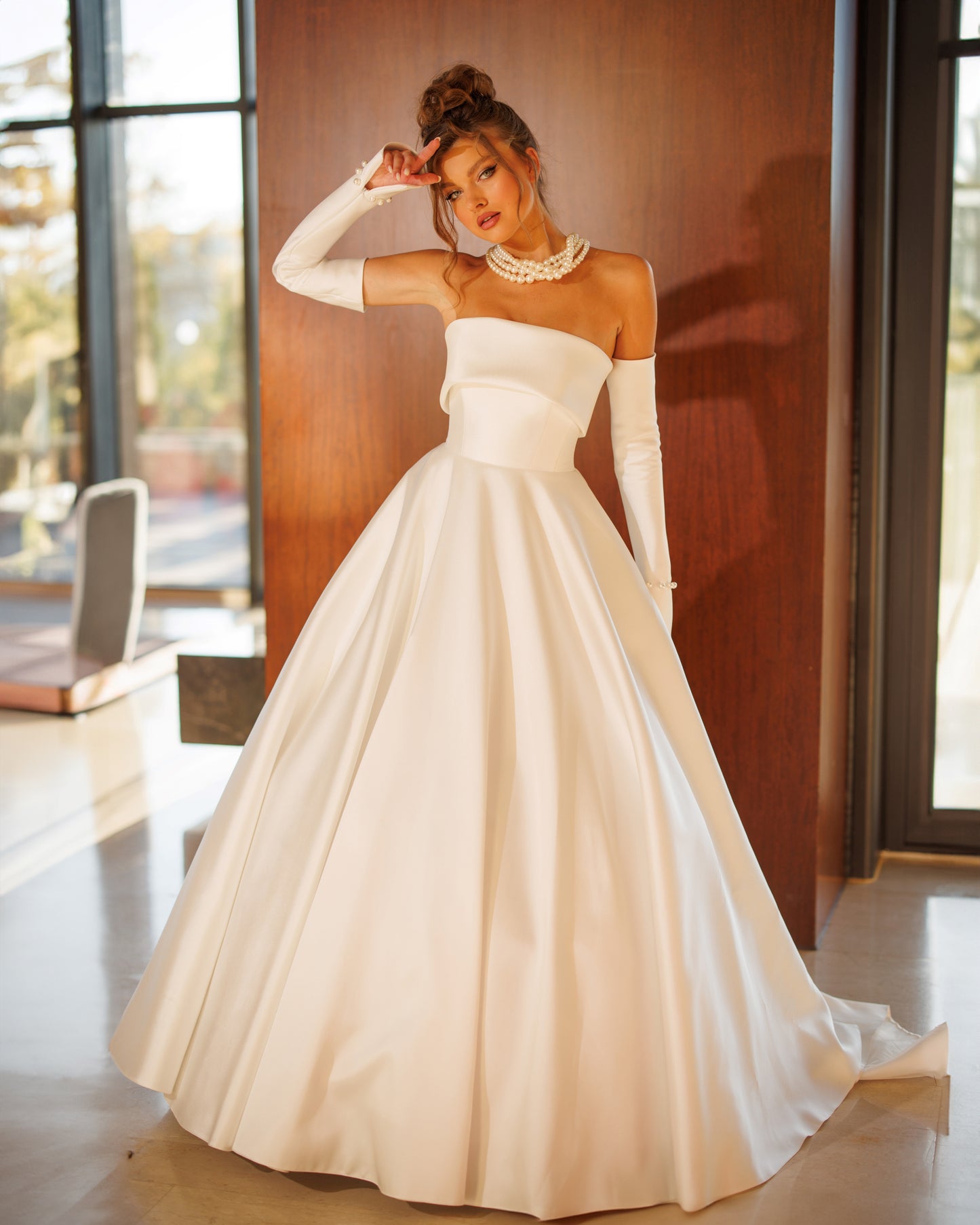 Princess A-line wedding dress with pearl slit sleeves.