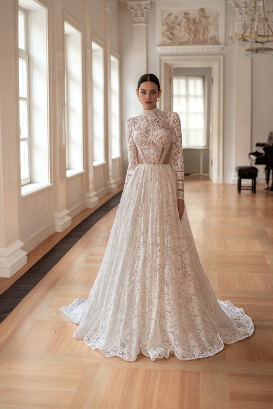 Princess wedding dress with chapel train and long sleeves.