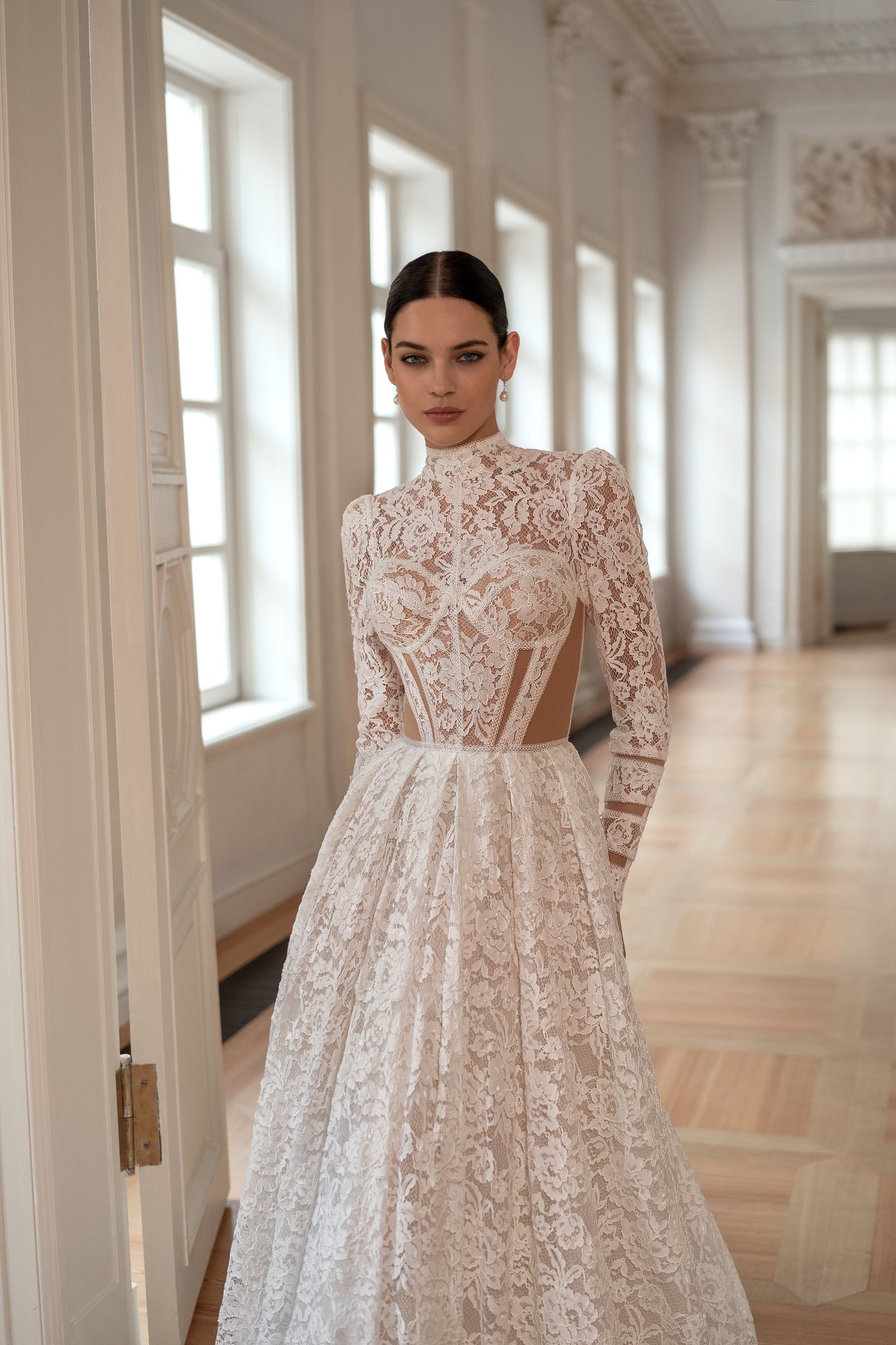 Princess wedding dress with chapel train and long sleeves.
