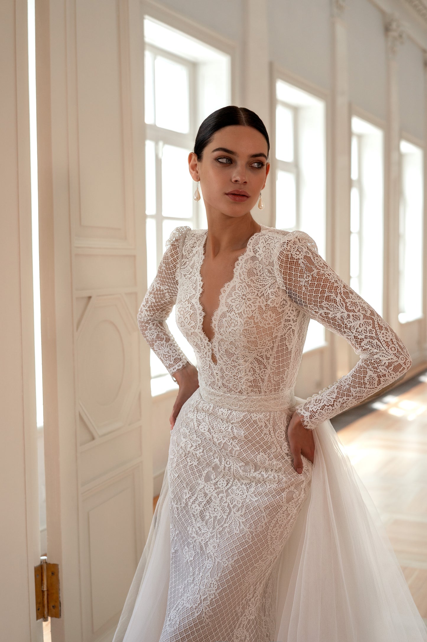 Mermaid wedding dress with lace, long sleeves, and open back