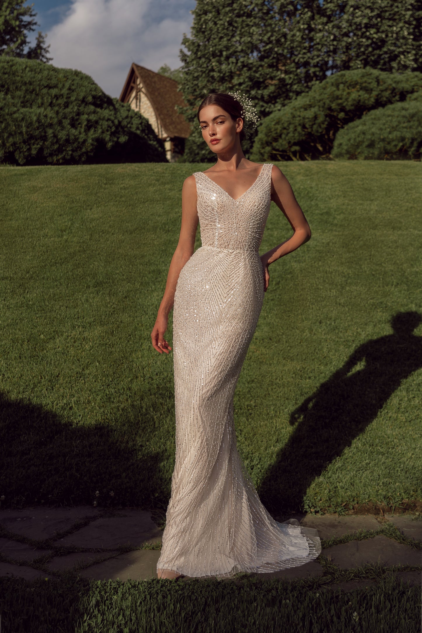 Sleeveless sheath wedding dress with tulle and sequin details