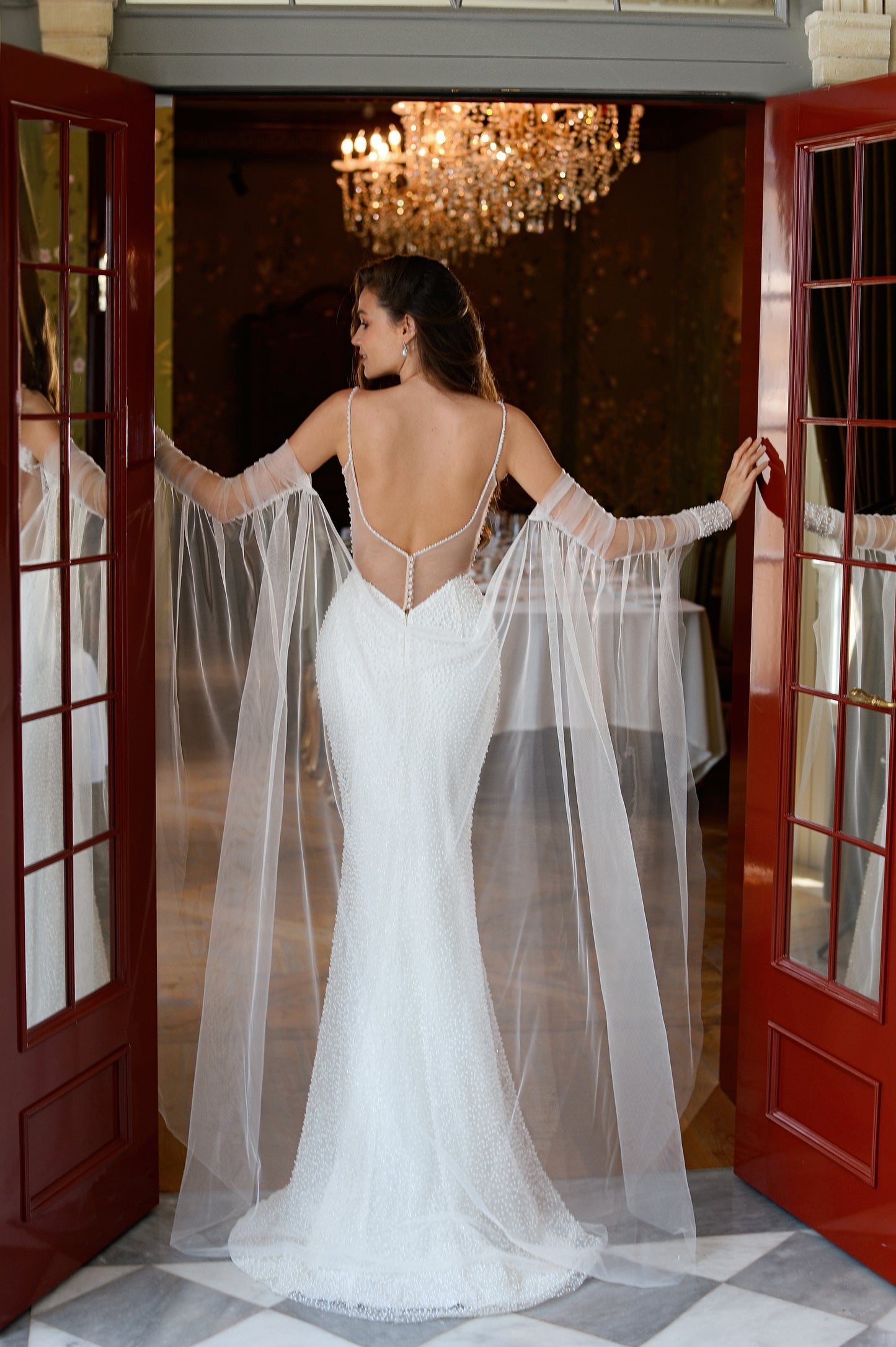Mermaid fitted wedding dress with backless design and sweep train