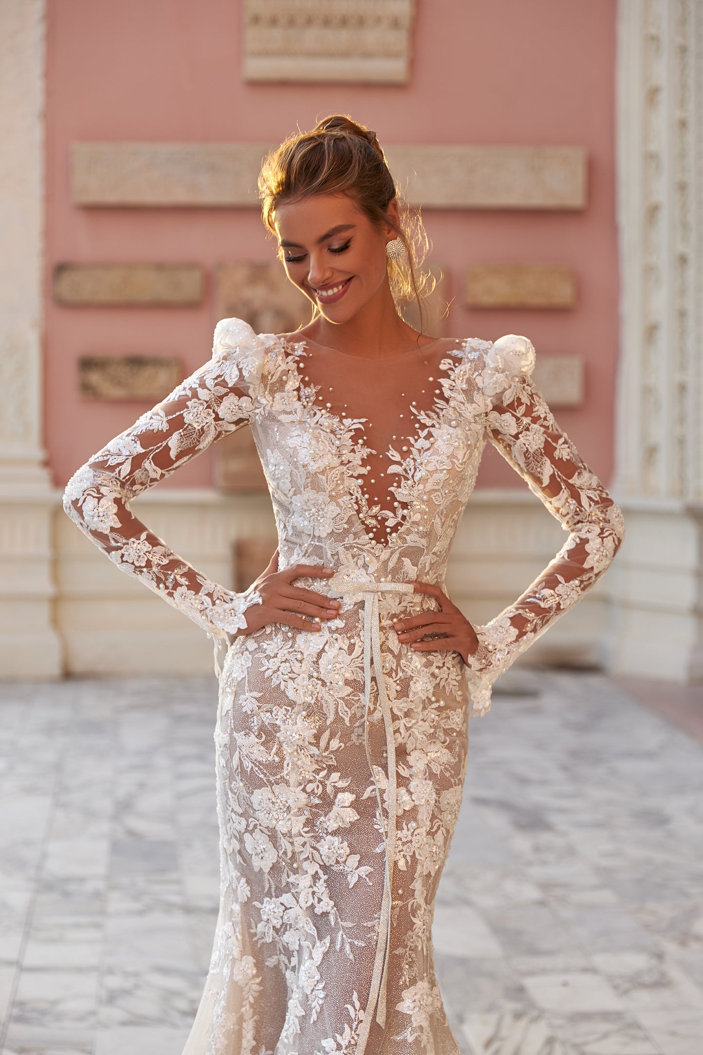 Fitted long sleeve lace wedding dress with fishtail train