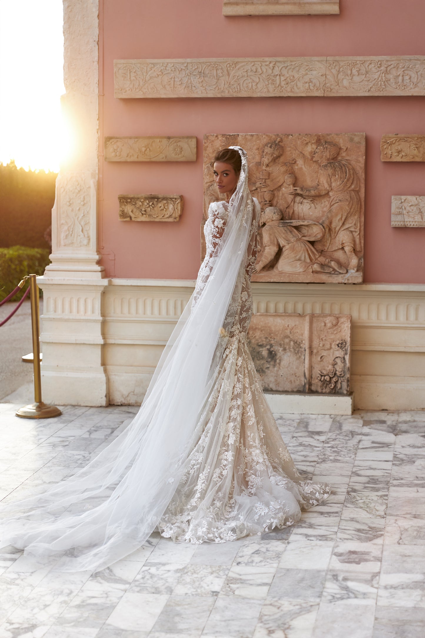 Fitted long sleeve lace wedding dress with fishtail train