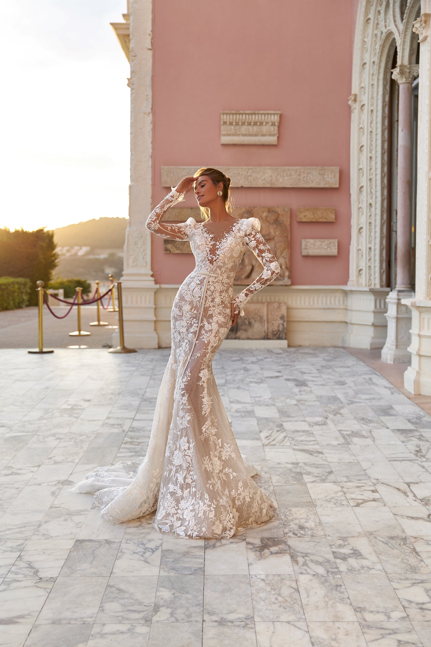Fitted long sleeve lace wedding dress with fishtail train