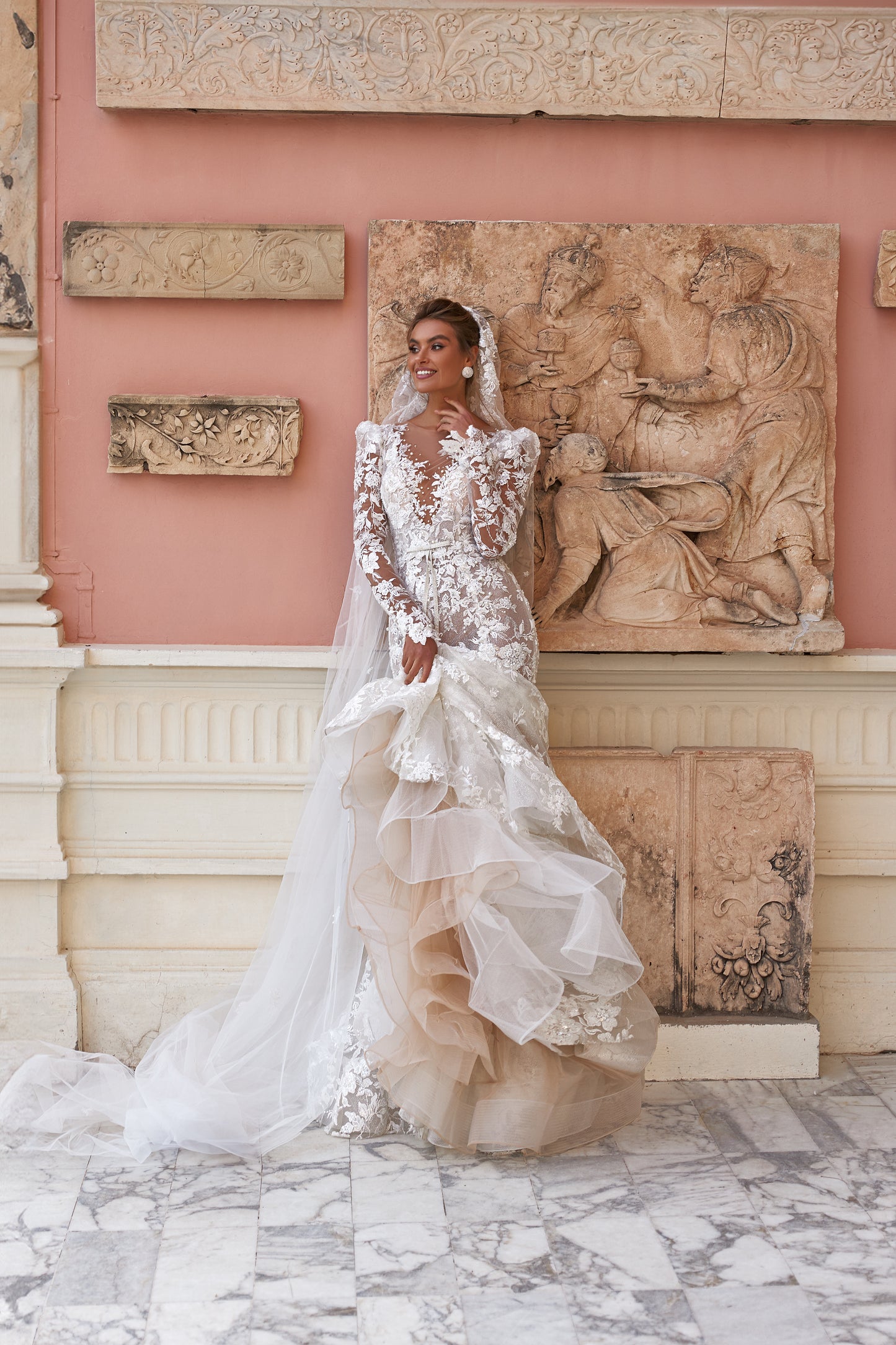 Fitted long sleeve lace wedding dress with fishtail train
