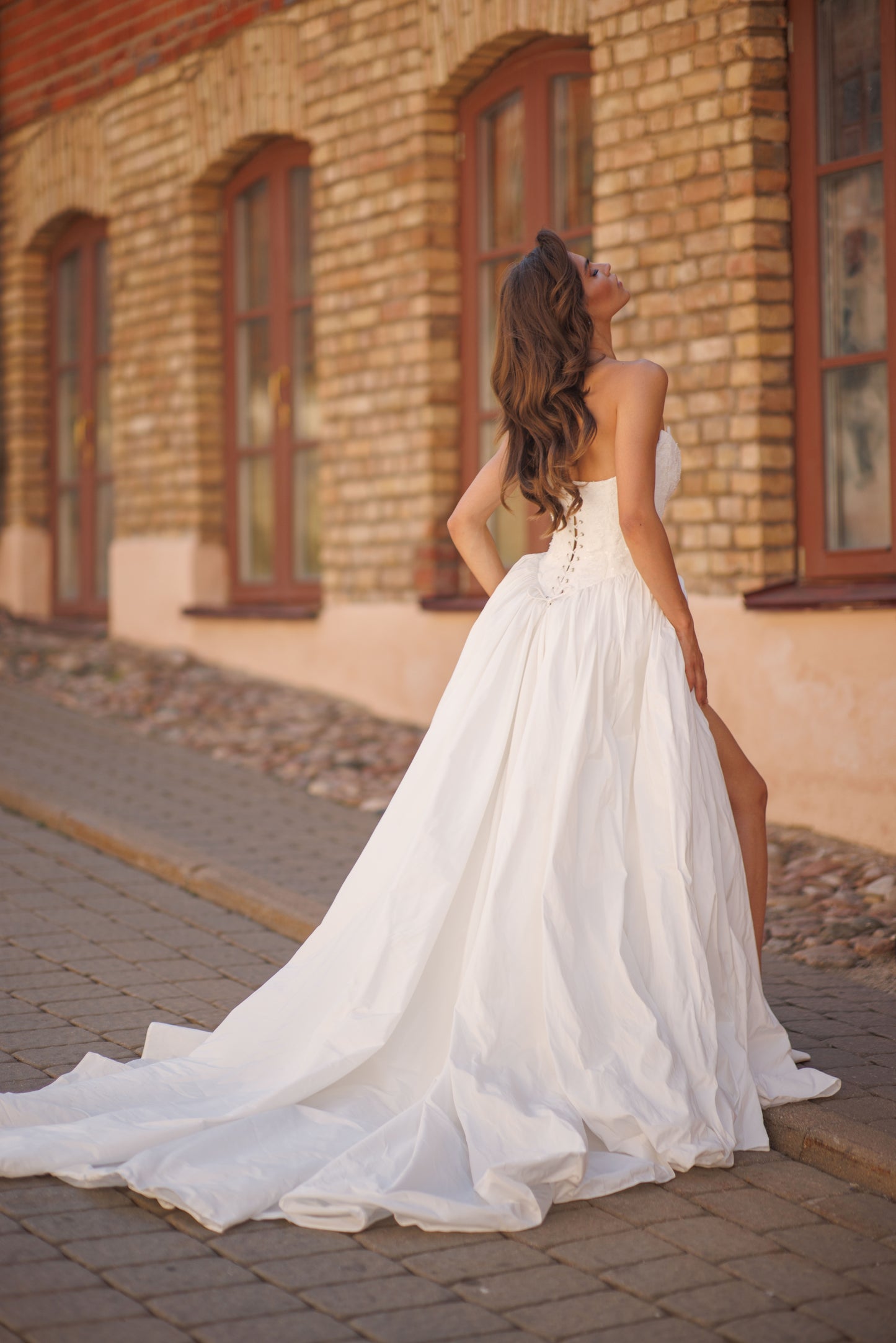 Princess wedding dress with chapel train and lace-up corset
