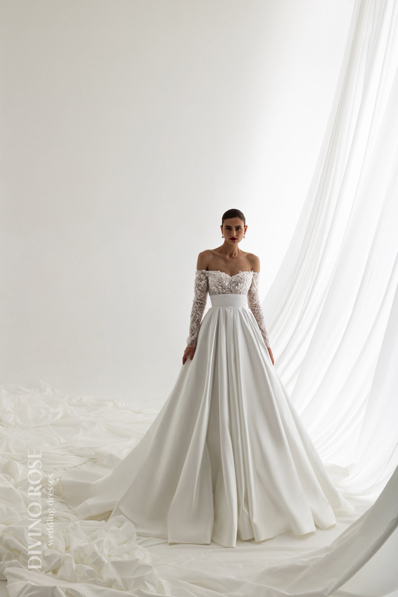 Off the shoulder satin wedding dress with chapel train