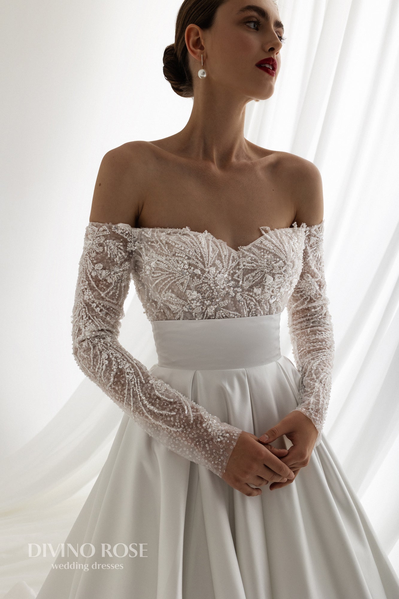 Off the shoulder satin wedding dress with chapel train