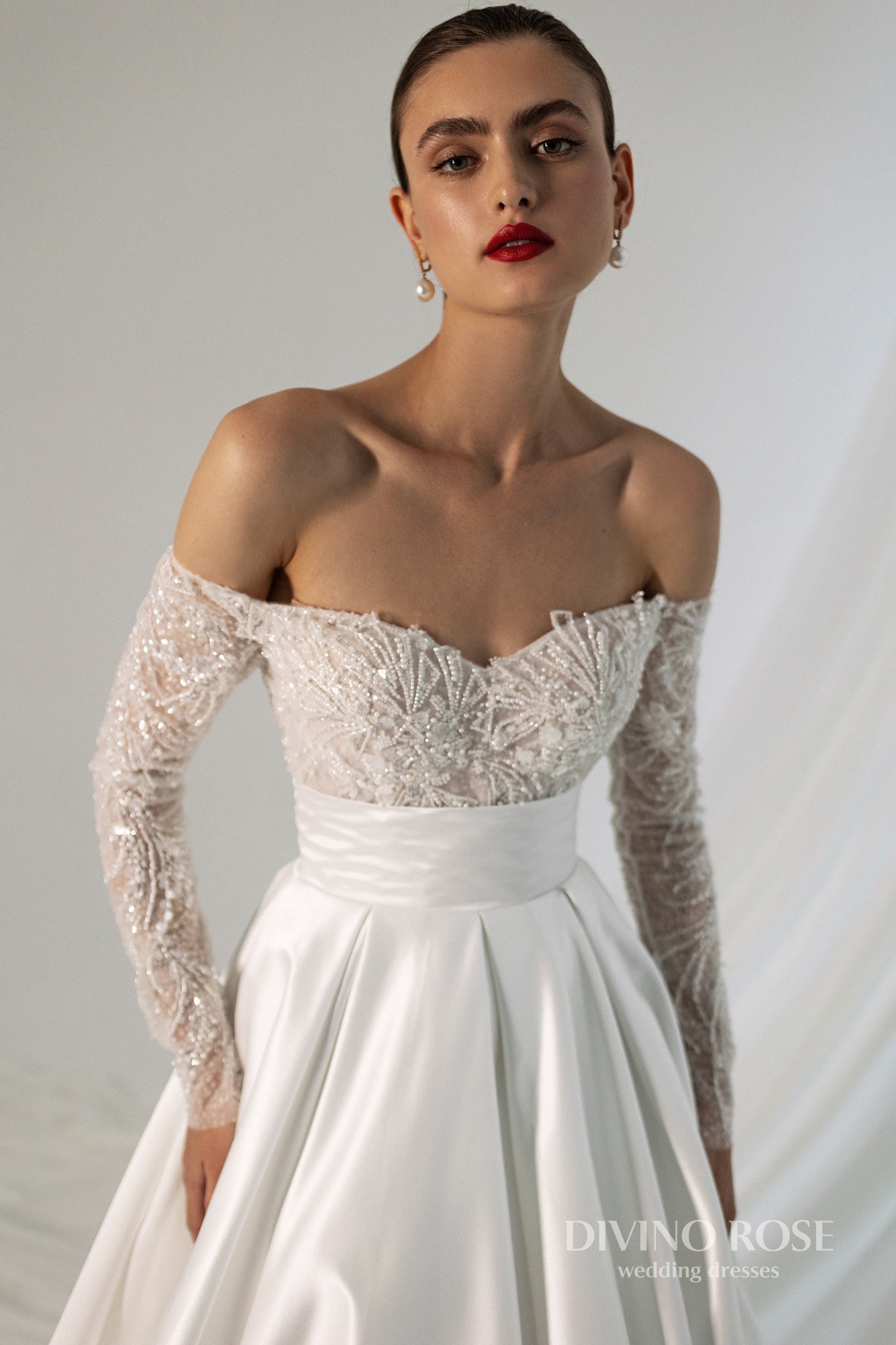 Off the shoulder satin wedding dress with chapel train