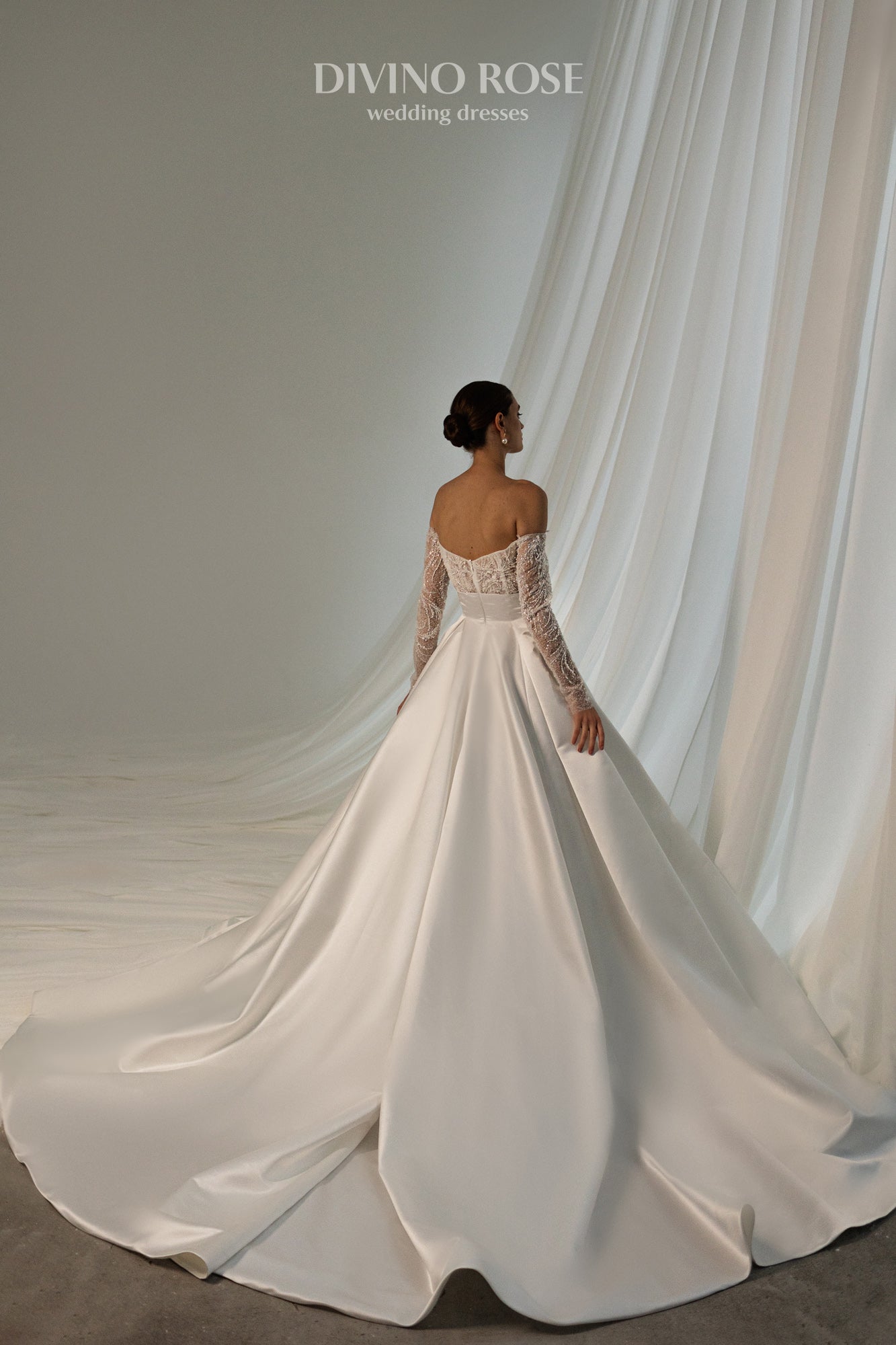 Off the shoulder satin wedding dress with chapel train