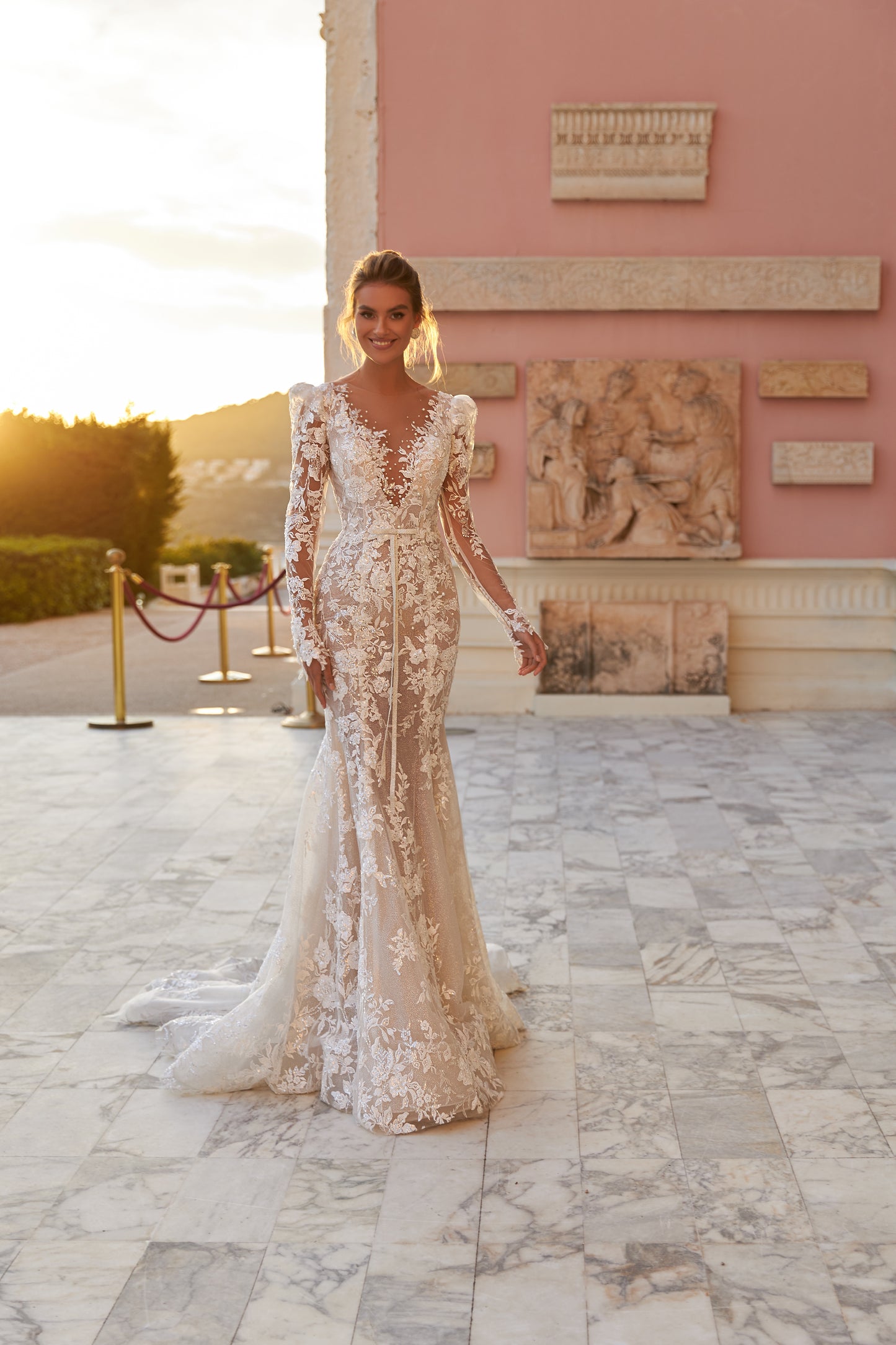 Fitted long sleeve lace wedding dress with fishtail train