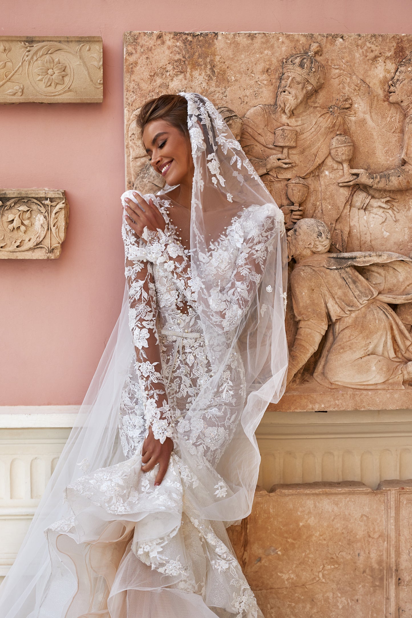 Fitted long sleeve lace wedding dress with fishtail train