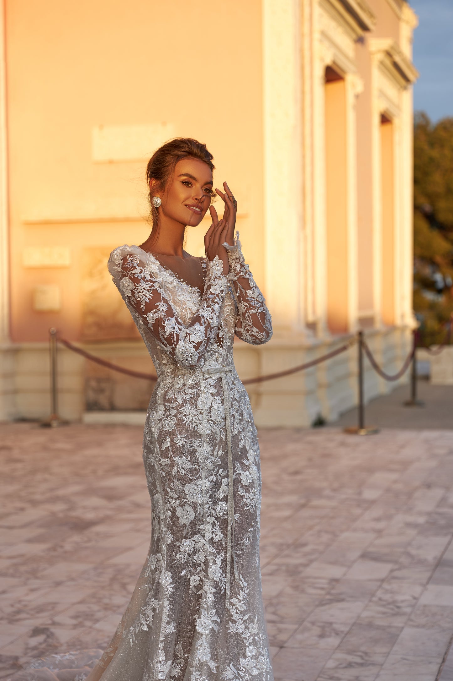 Fitted long sleeve lace wedding dress with fishtail train
