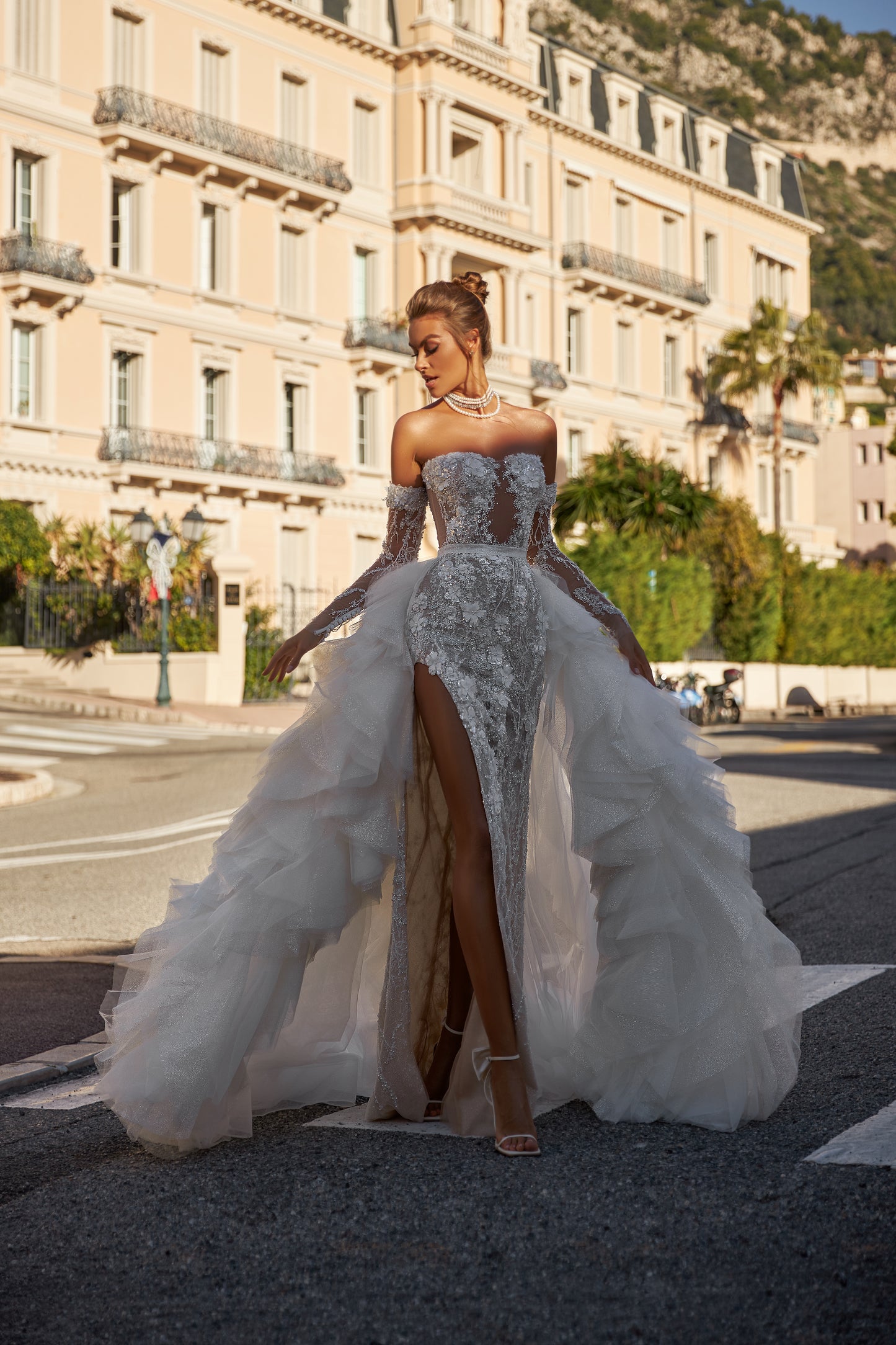Modern fitted wedding dress with detachable ruffled overskirt
