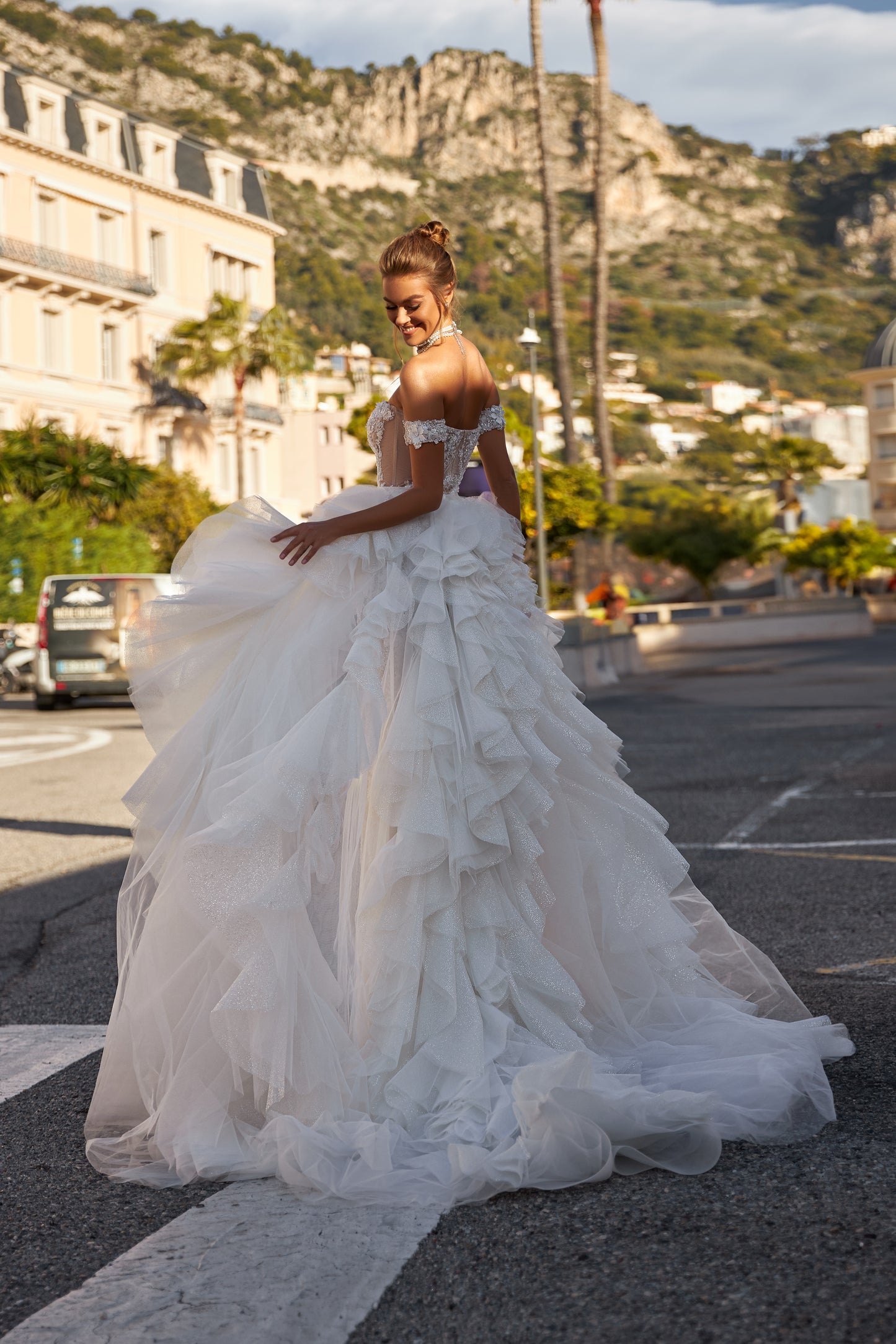 Modern fitted wedding dress with detachable ruffled overskirt