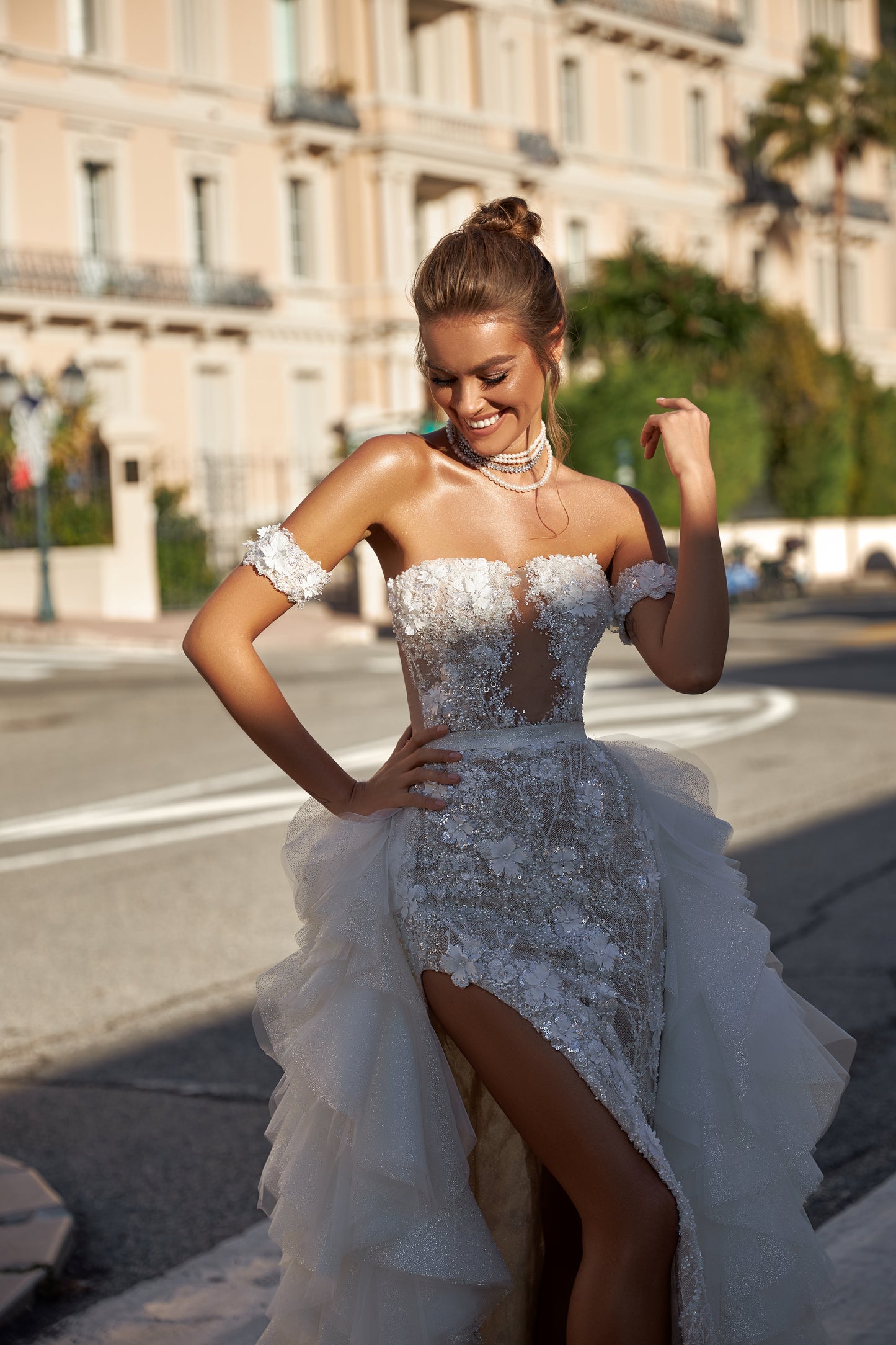 Modern fitted wedding dress with detachable ruffled overskirt