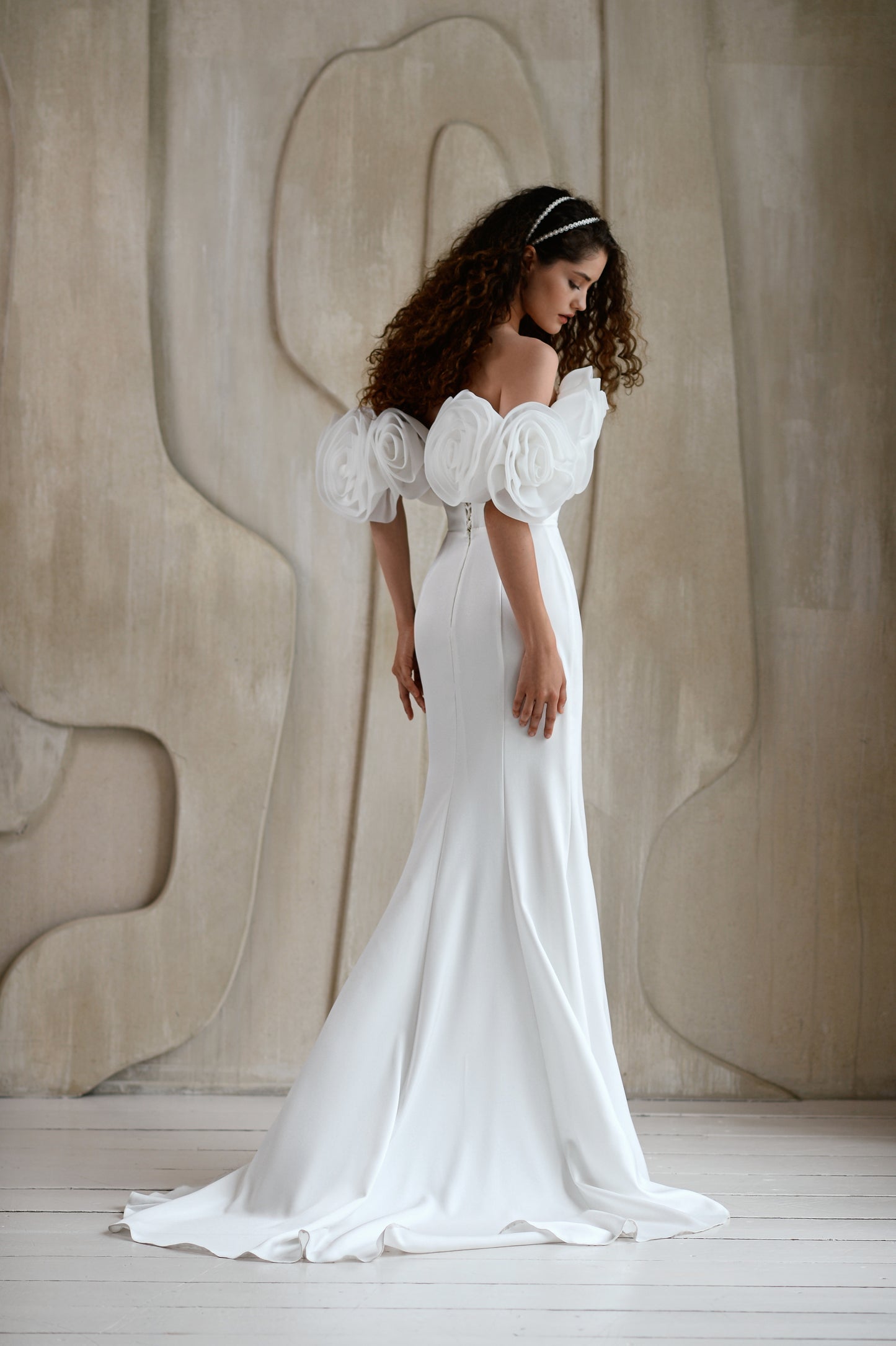Minimalist mermaid wedding dress with boat neckline and sweep train
