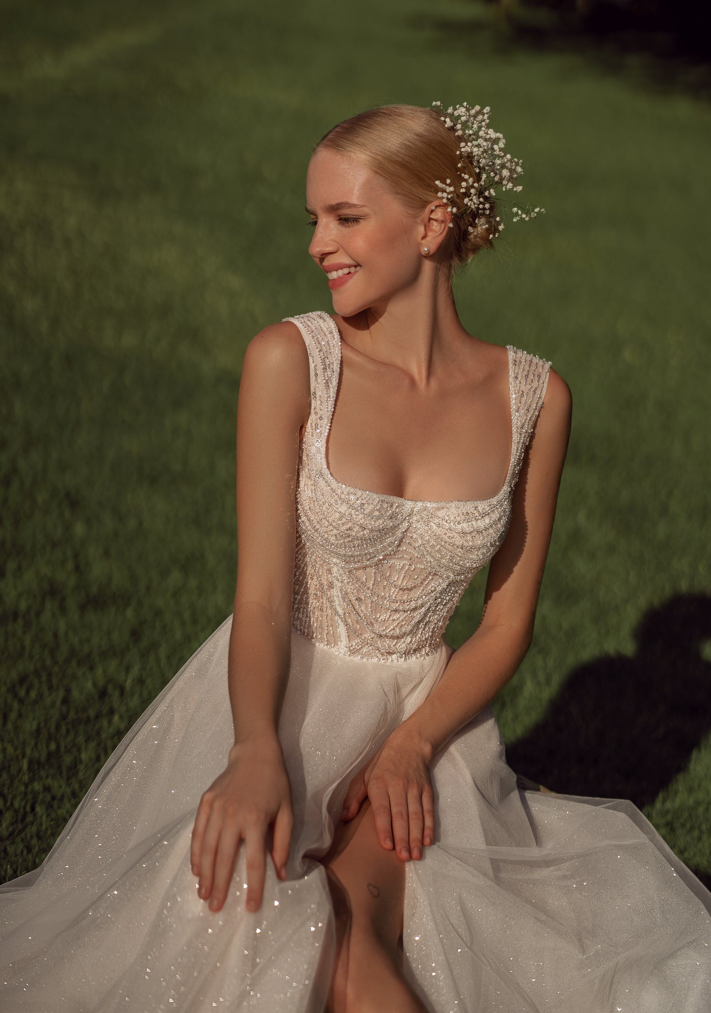 Sleeveless A-line wedding dress with open back & court train