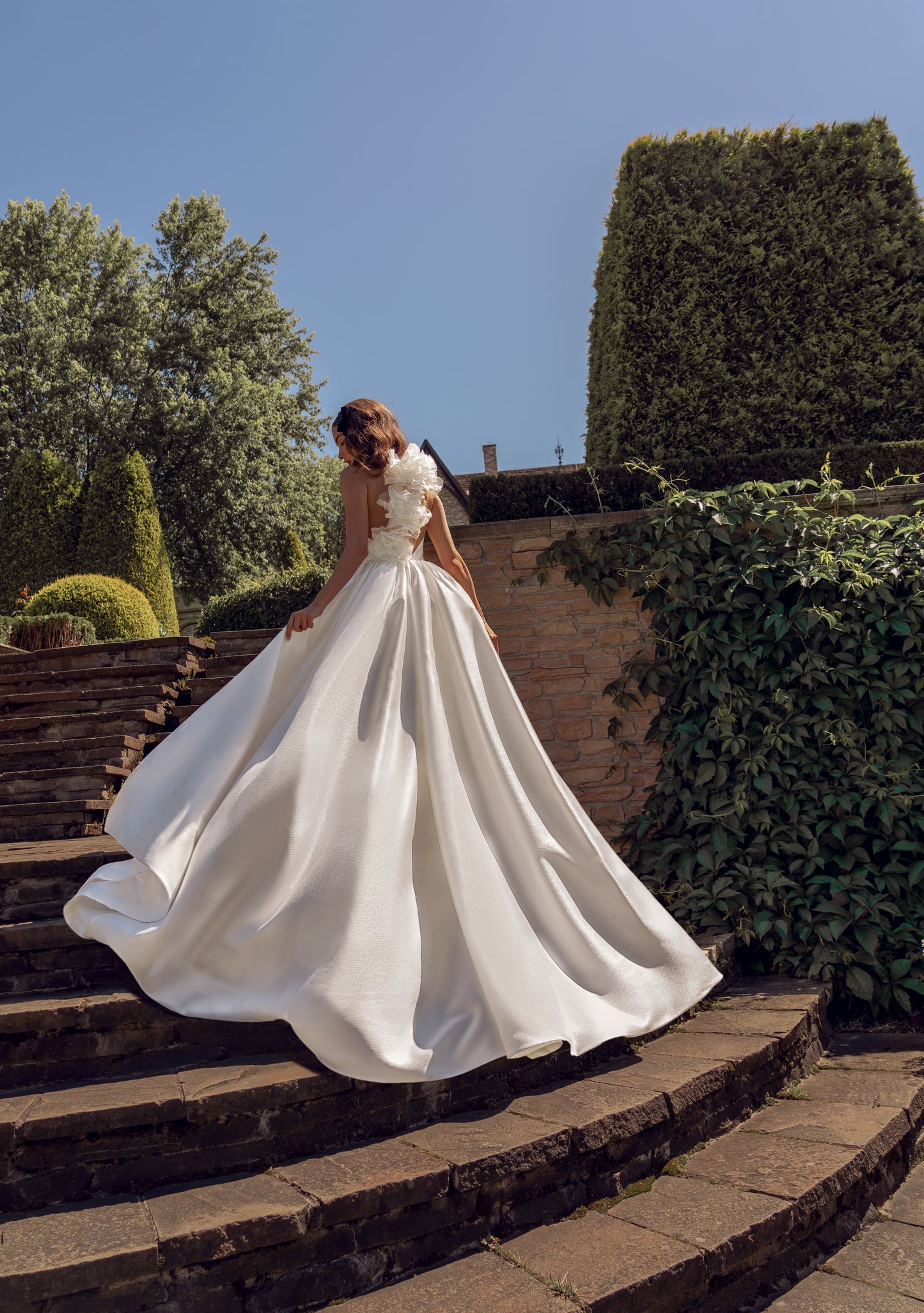 Jacquard mermaid wedding dress with 3D floral back details.