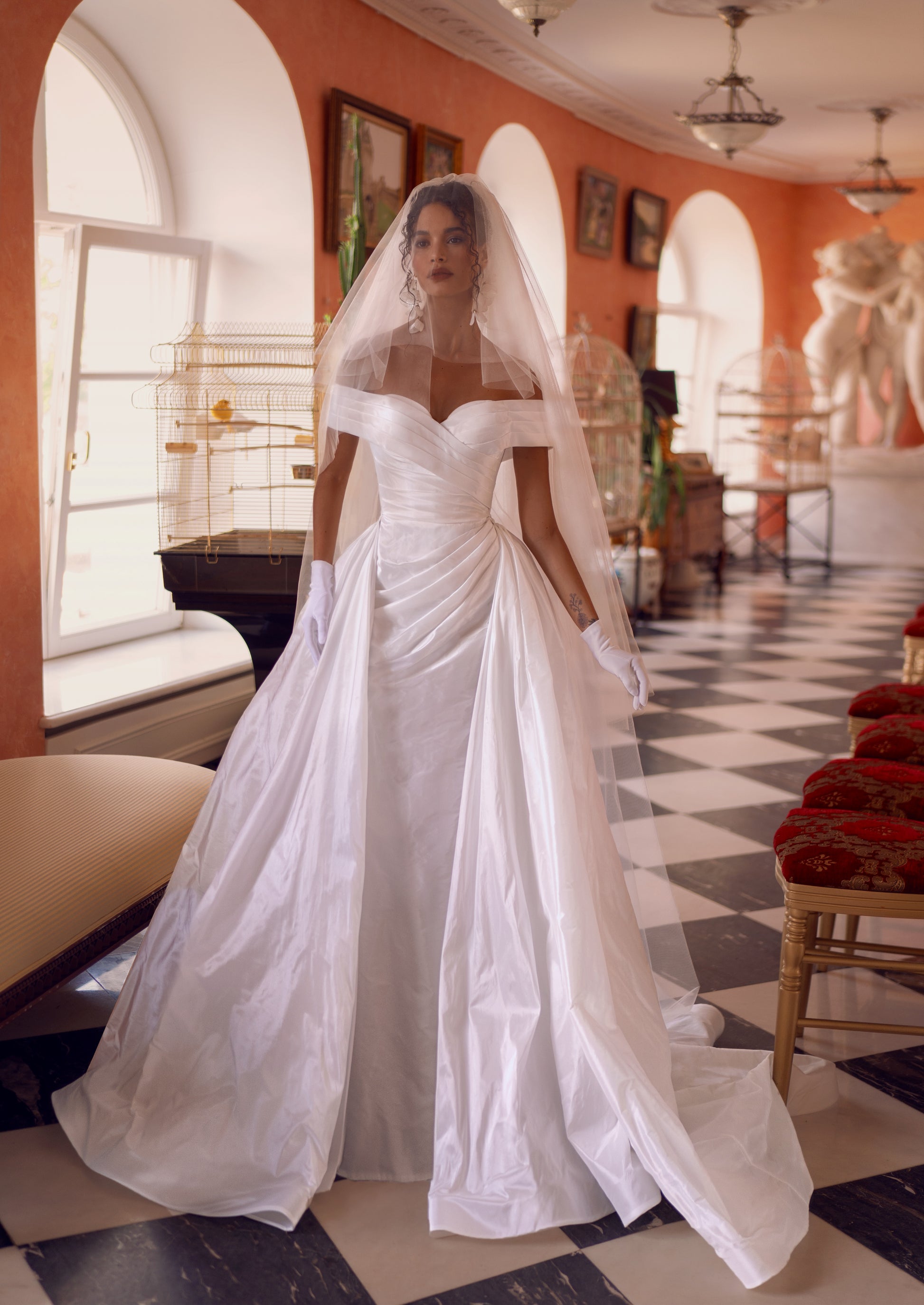 off-shoulder taffeta mermaid wedding dress with pleated bodice and detachable ball gown overskirt