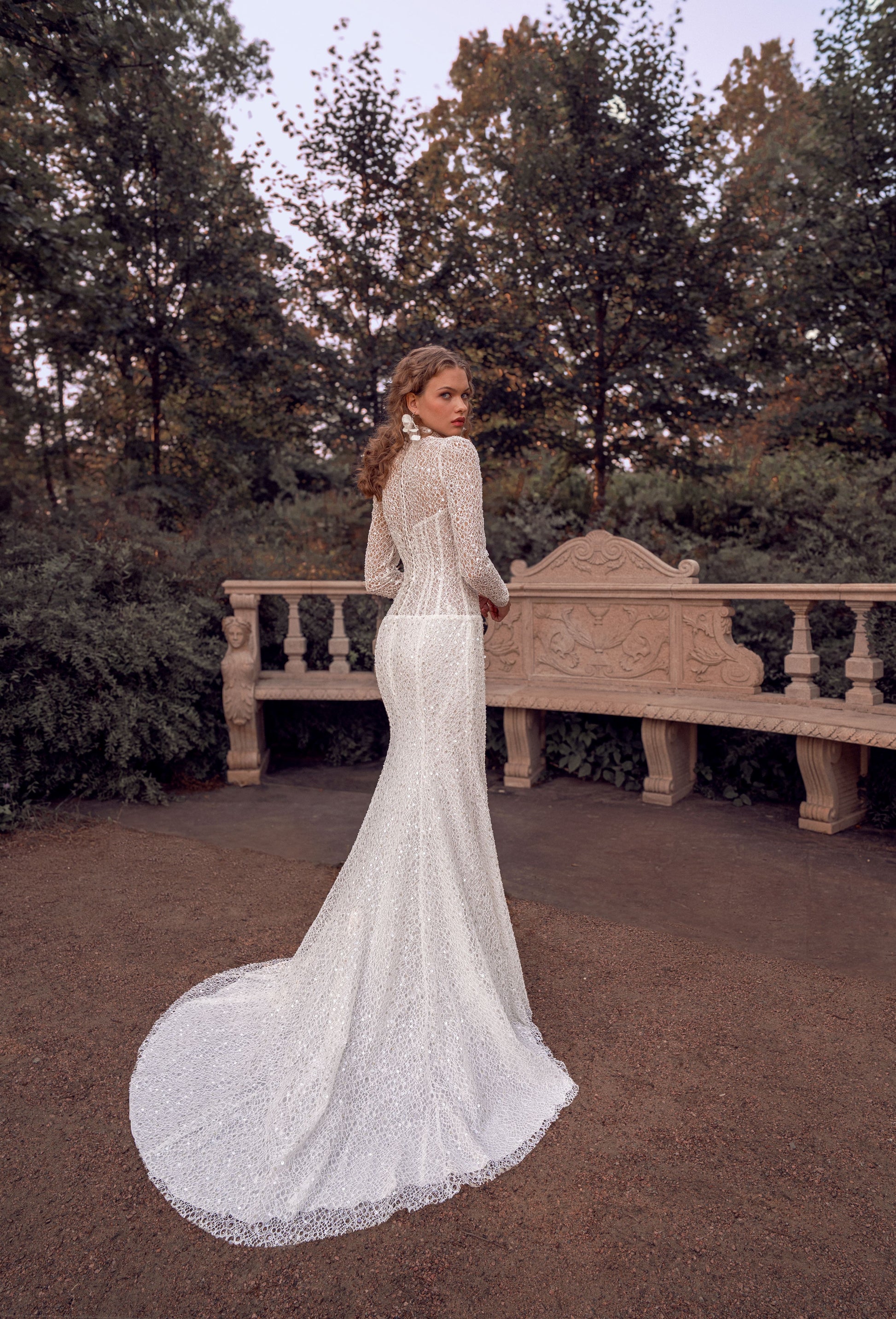 long sleeve lace mermaid wedding dress with high neckline, beaded illusion bodice and floral waist accent