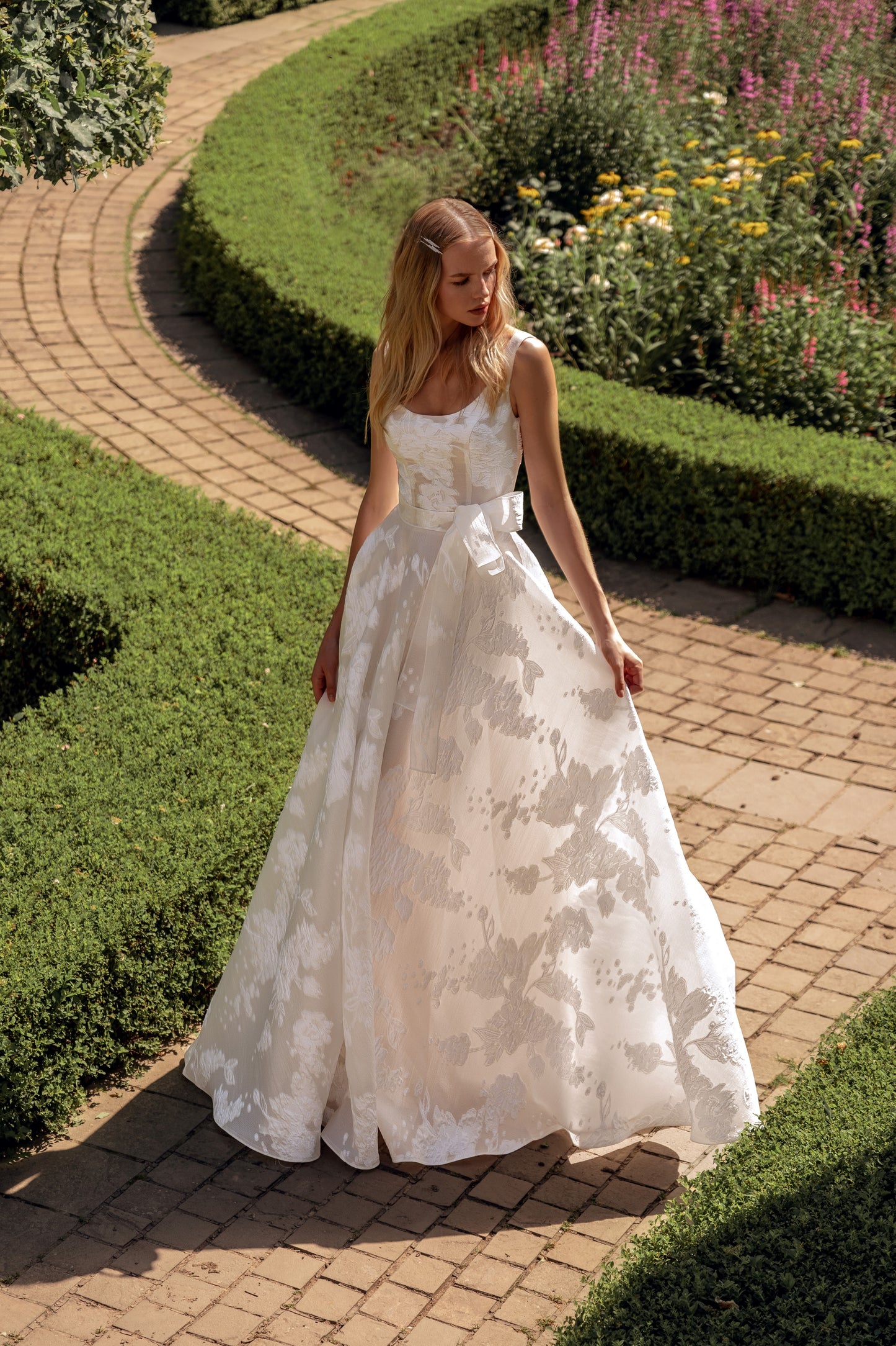 Sleeveless A-line wedding dress with floral jacquard details