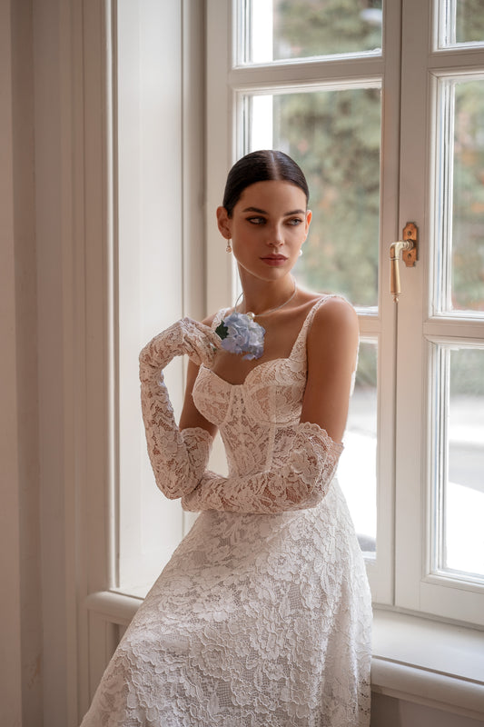 Sleeveless lace A-line wedding dress with open back and court train