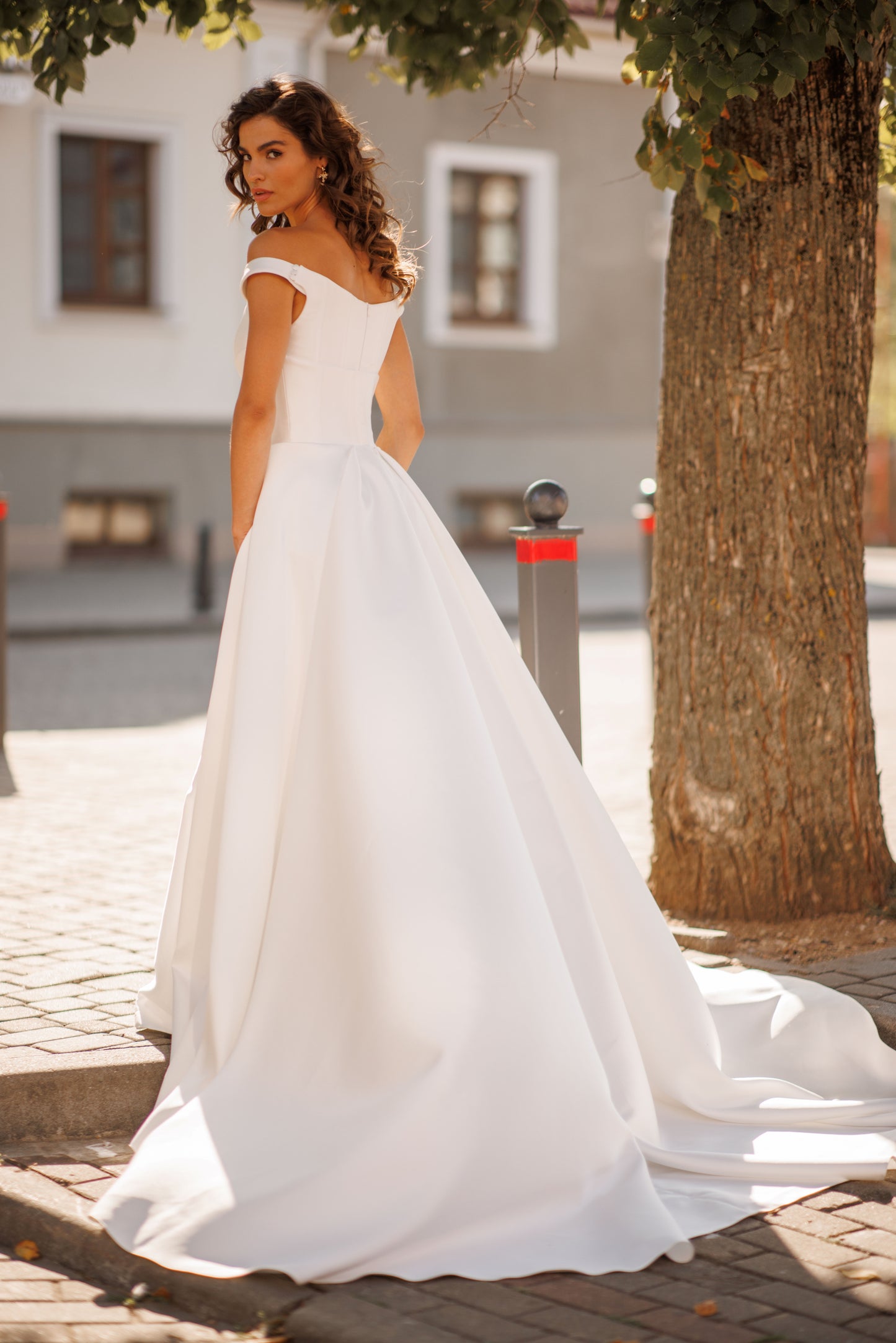 Minimalist Mikado mermaid off-the-shoulder wedding dress.