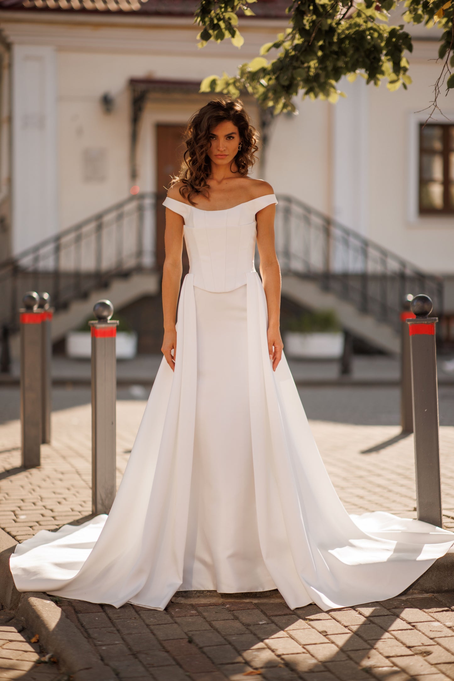 Minimalist Mikado mermaid off-the-shoulder wedding dress.