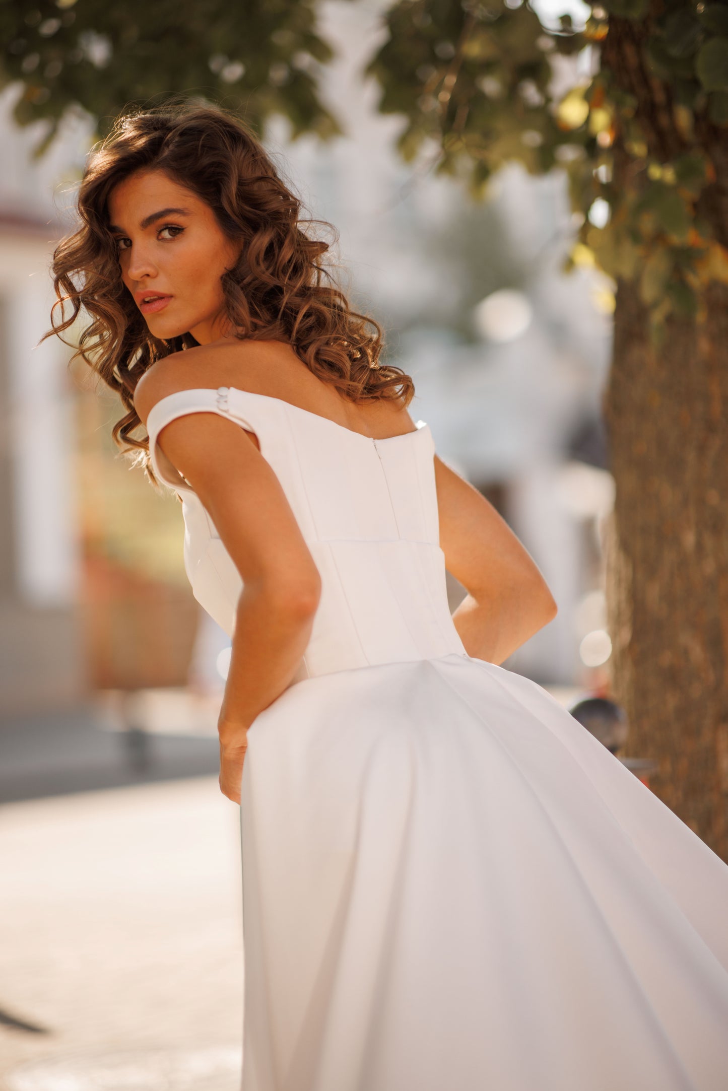 Minimalist Mikado mermaid off-the-shoulder wedding dress.