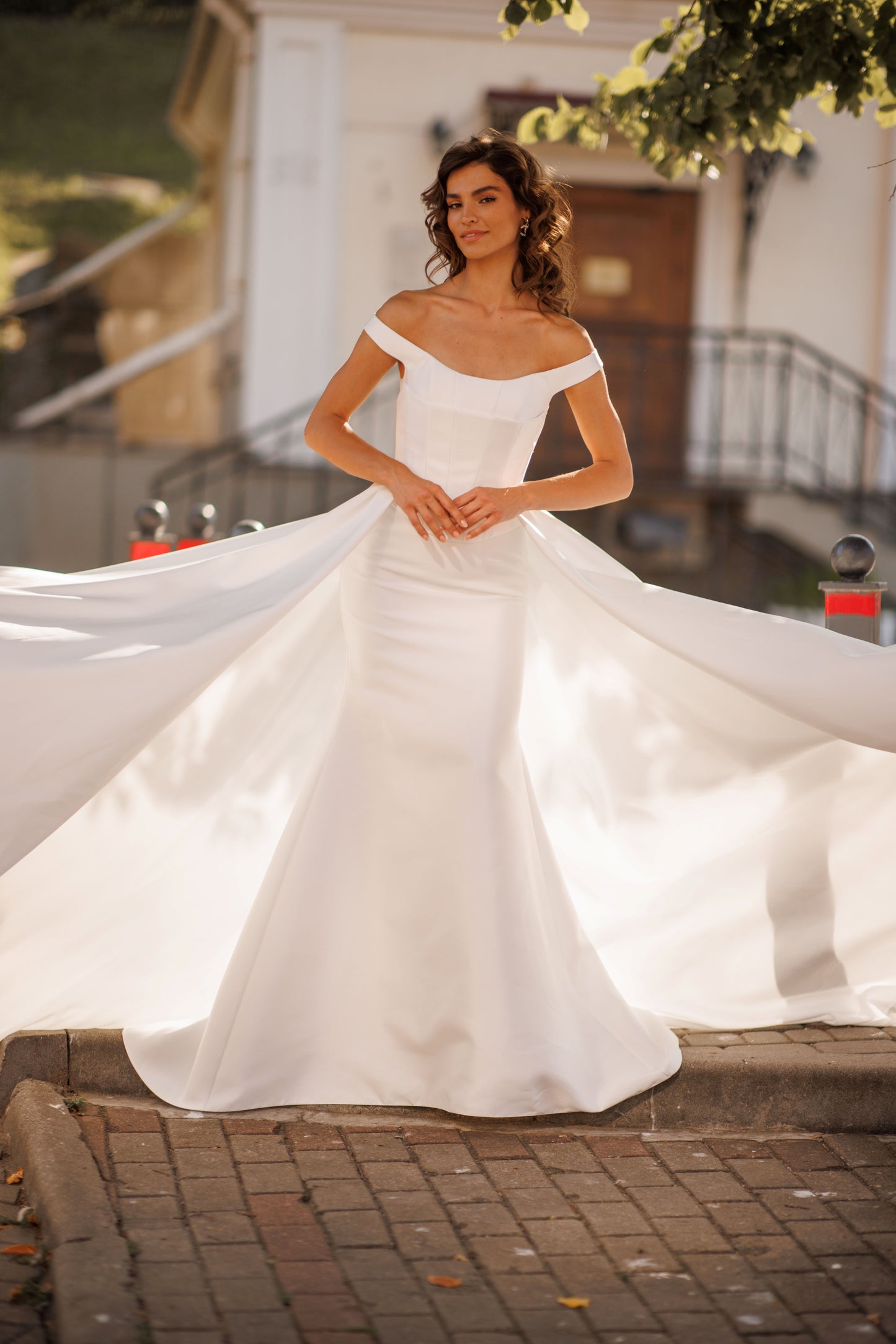 Minimalist Mikado mermaid off-the-shoulder wedding dress.