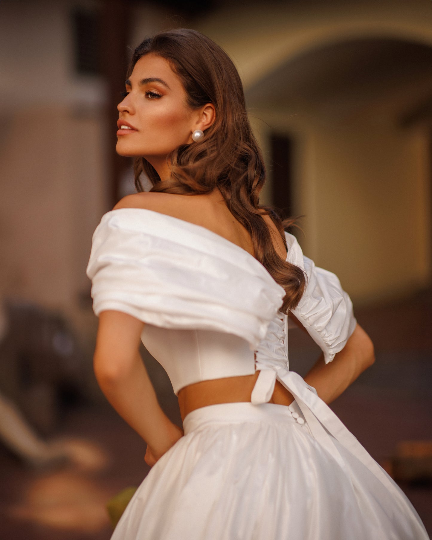 Two-piece A-line wedding dress with off-the-shoulder top.