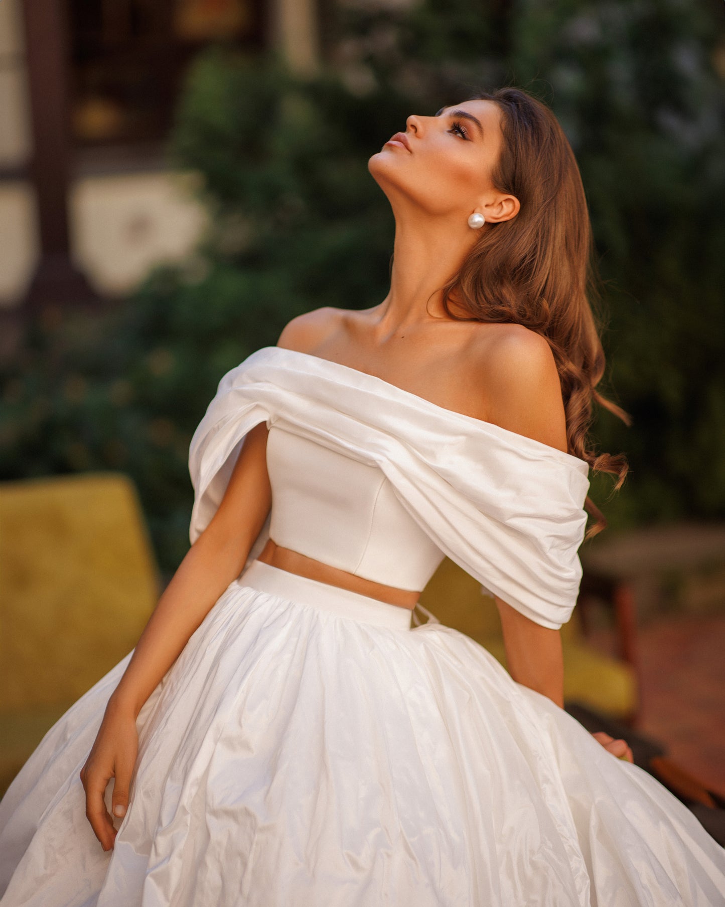 Two-piece A-line wedding dress with off-the-shoulder top.