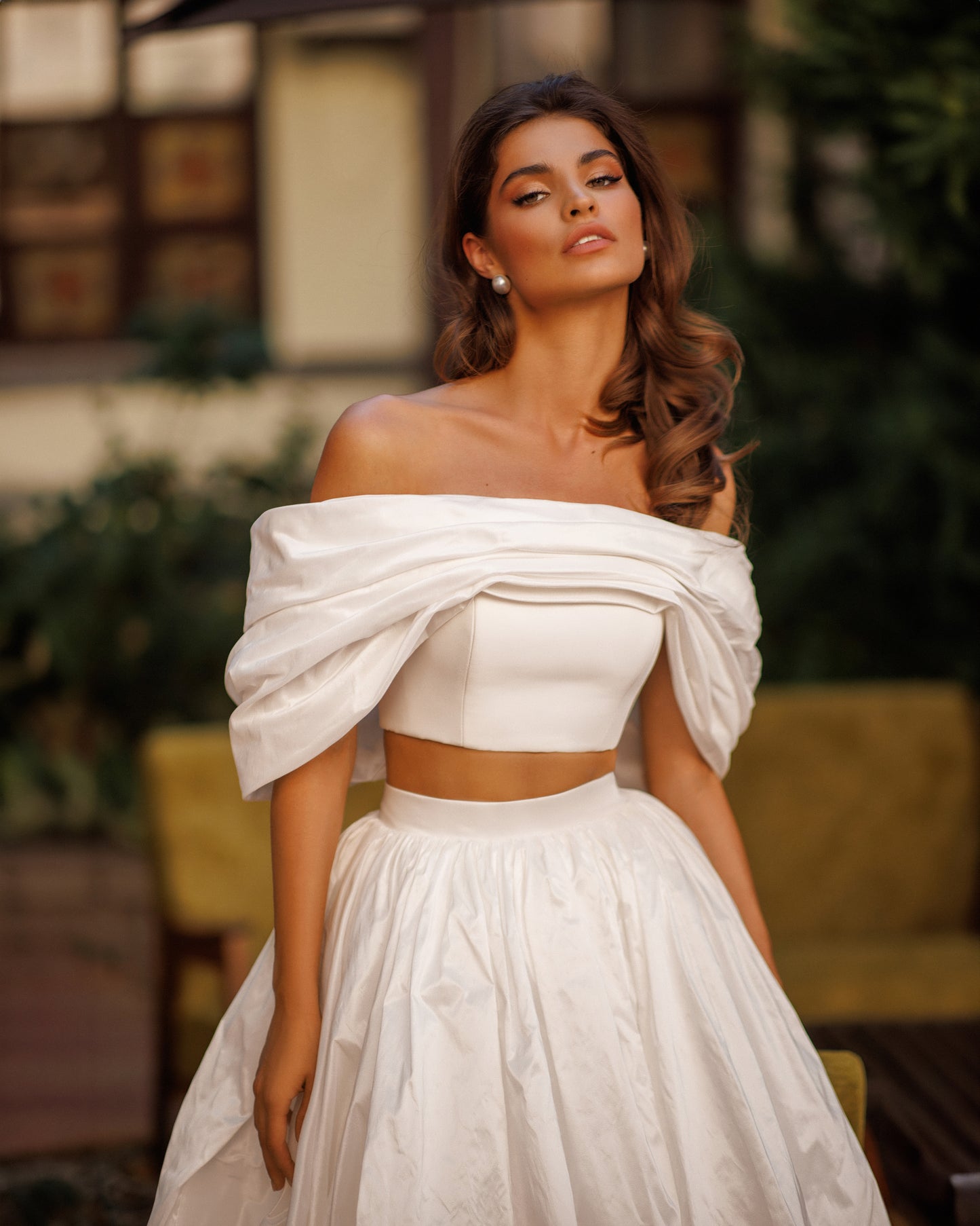 Two-piece A-line wedding dress with off-the-shoulder top.