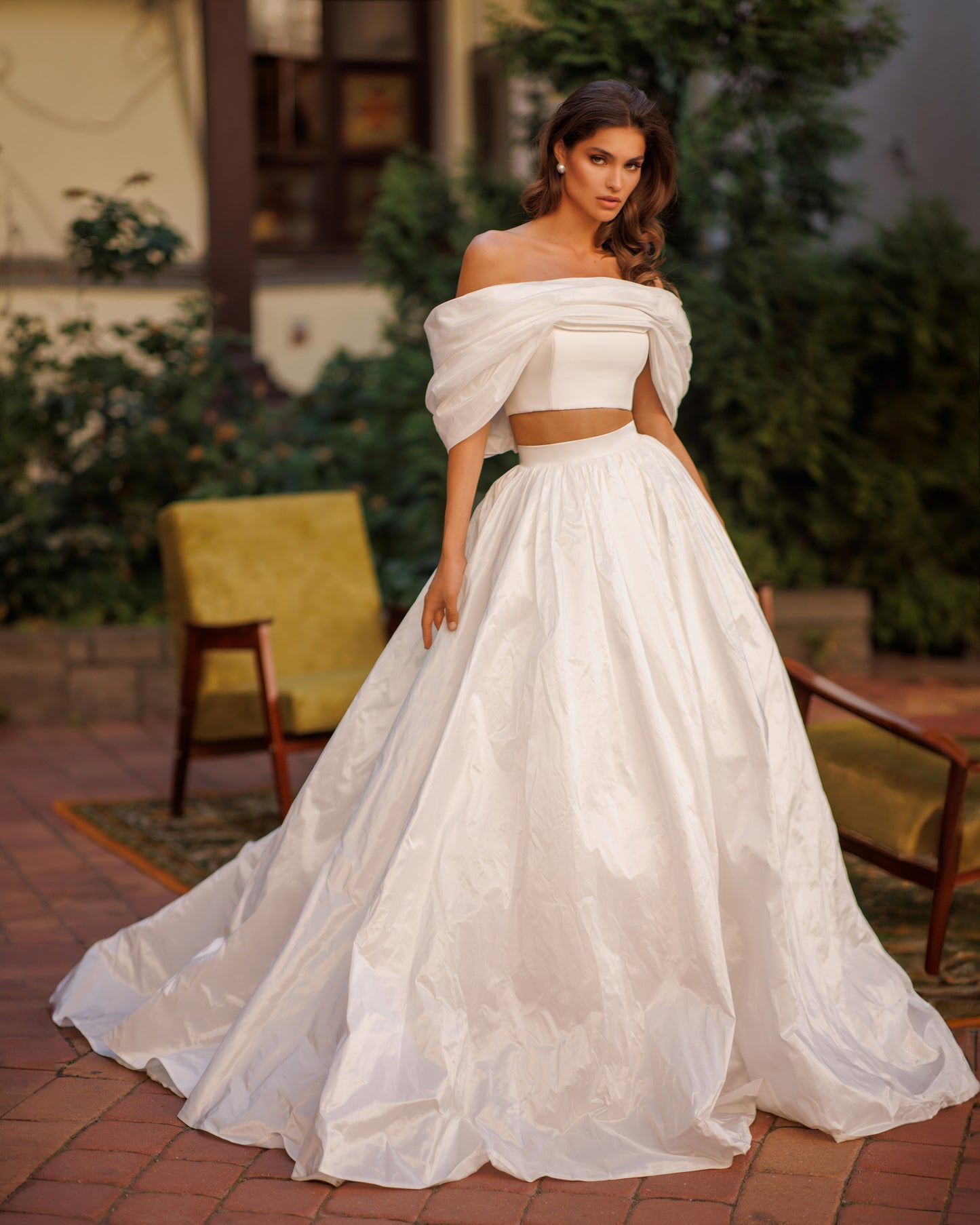 Two-piece A-line wedding dress with off-the-shoulder top.