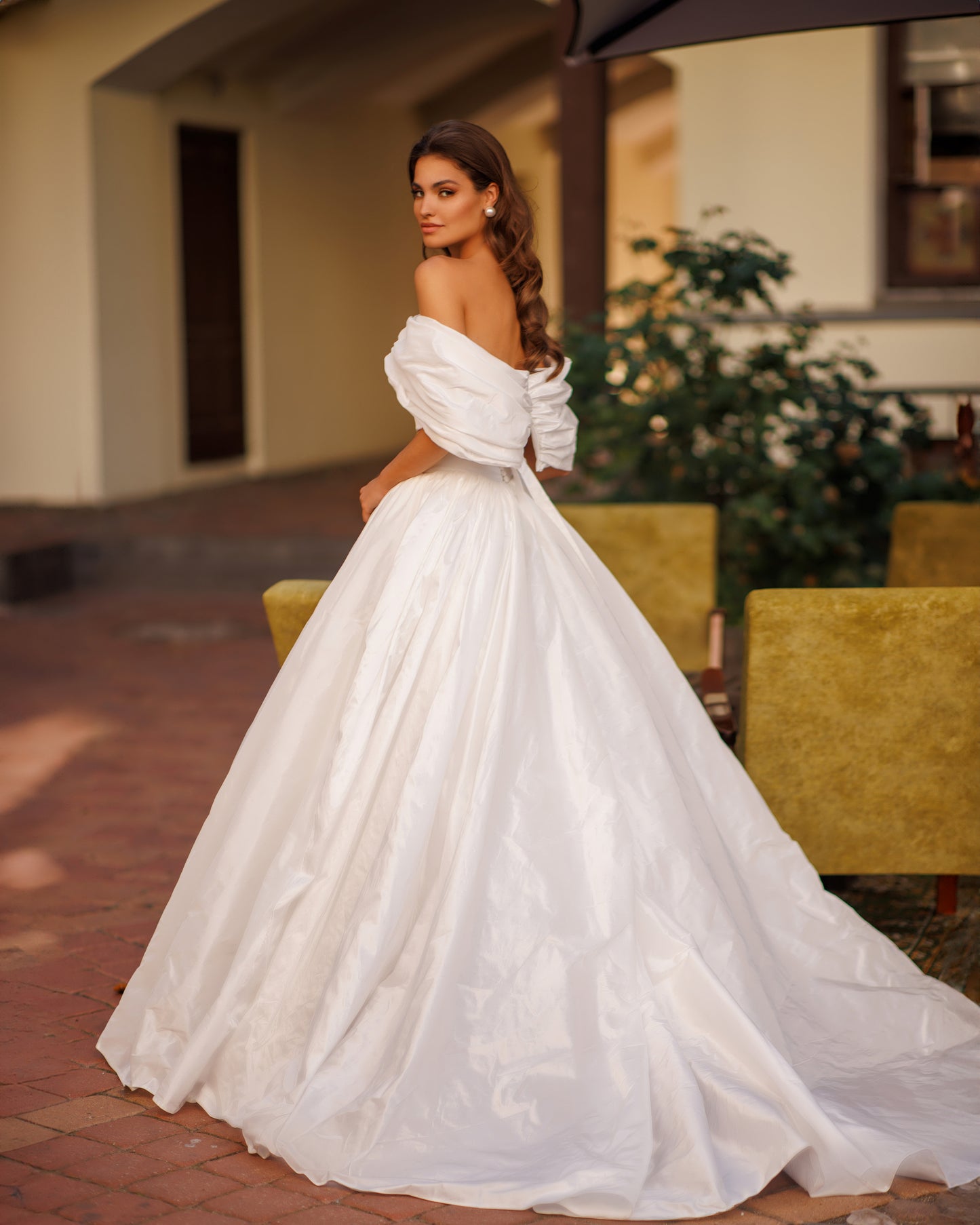 Two-piece A-line wedding dress with off-the-shoulder top.