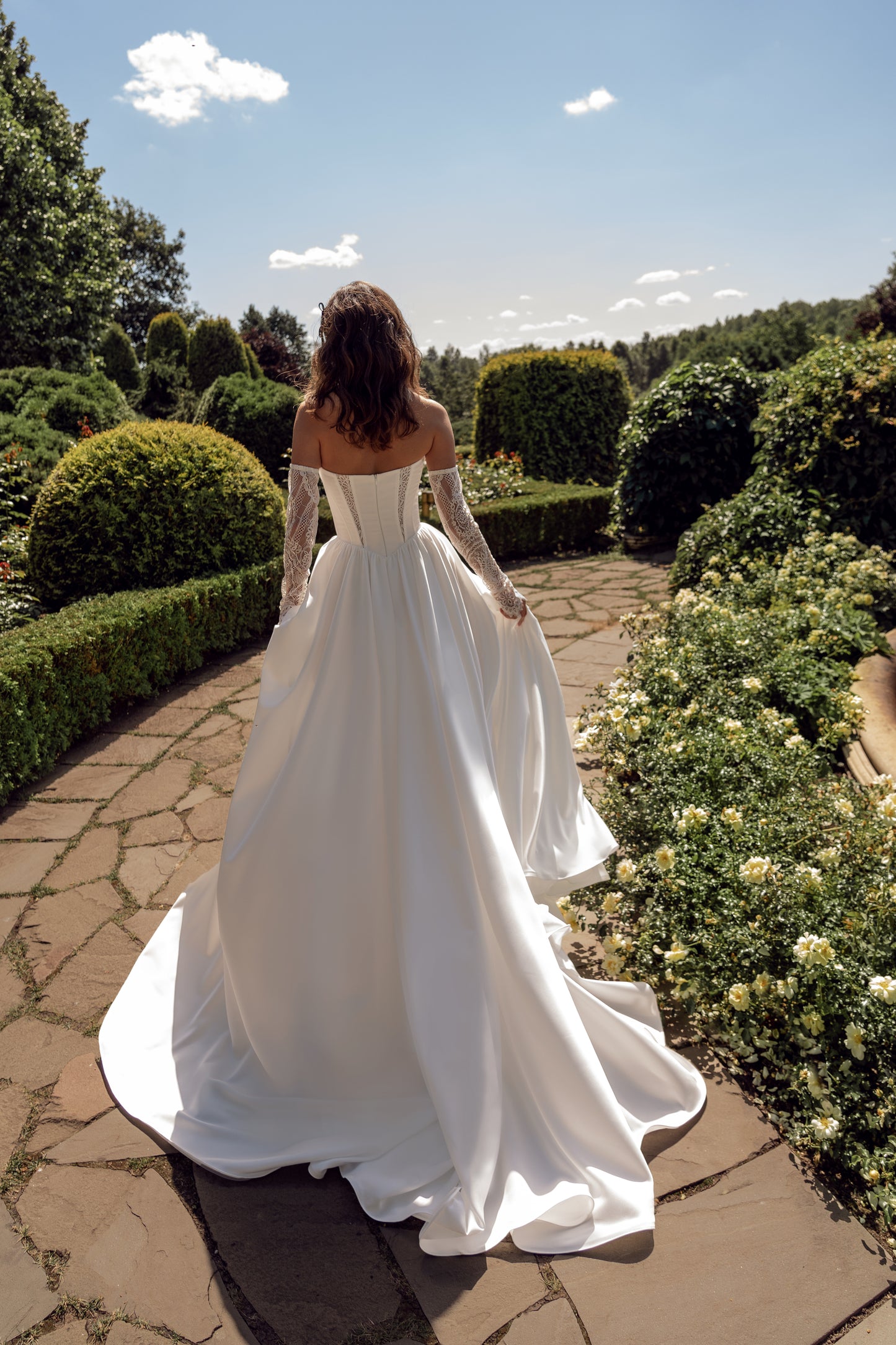 Modern A-line wedding dress with deep V neckline and slit skirt