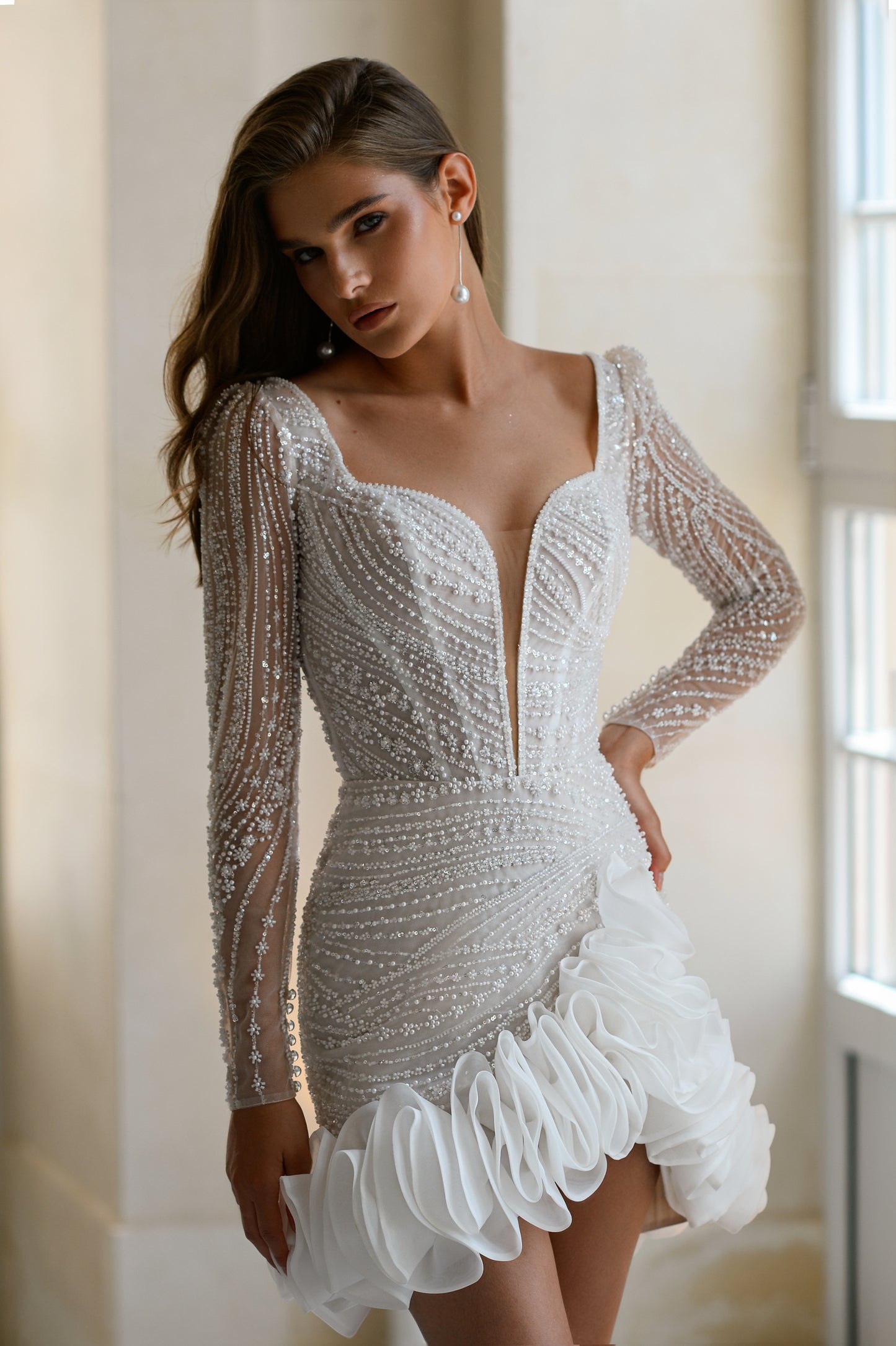 Mini lace wedding dress with deep V neckline and ruffled skirt