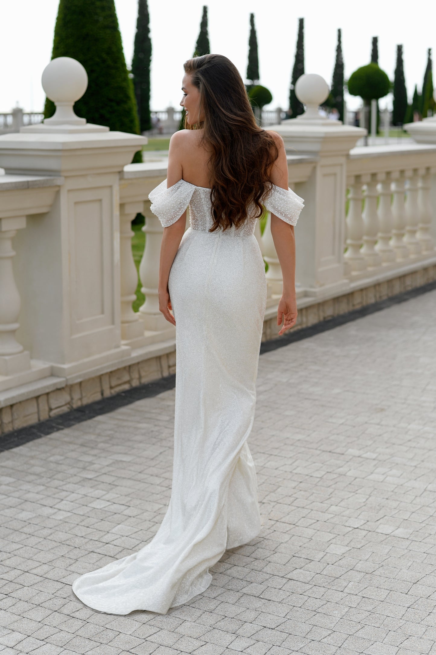Glitter sheath wedding dress with sequin bodice and train.