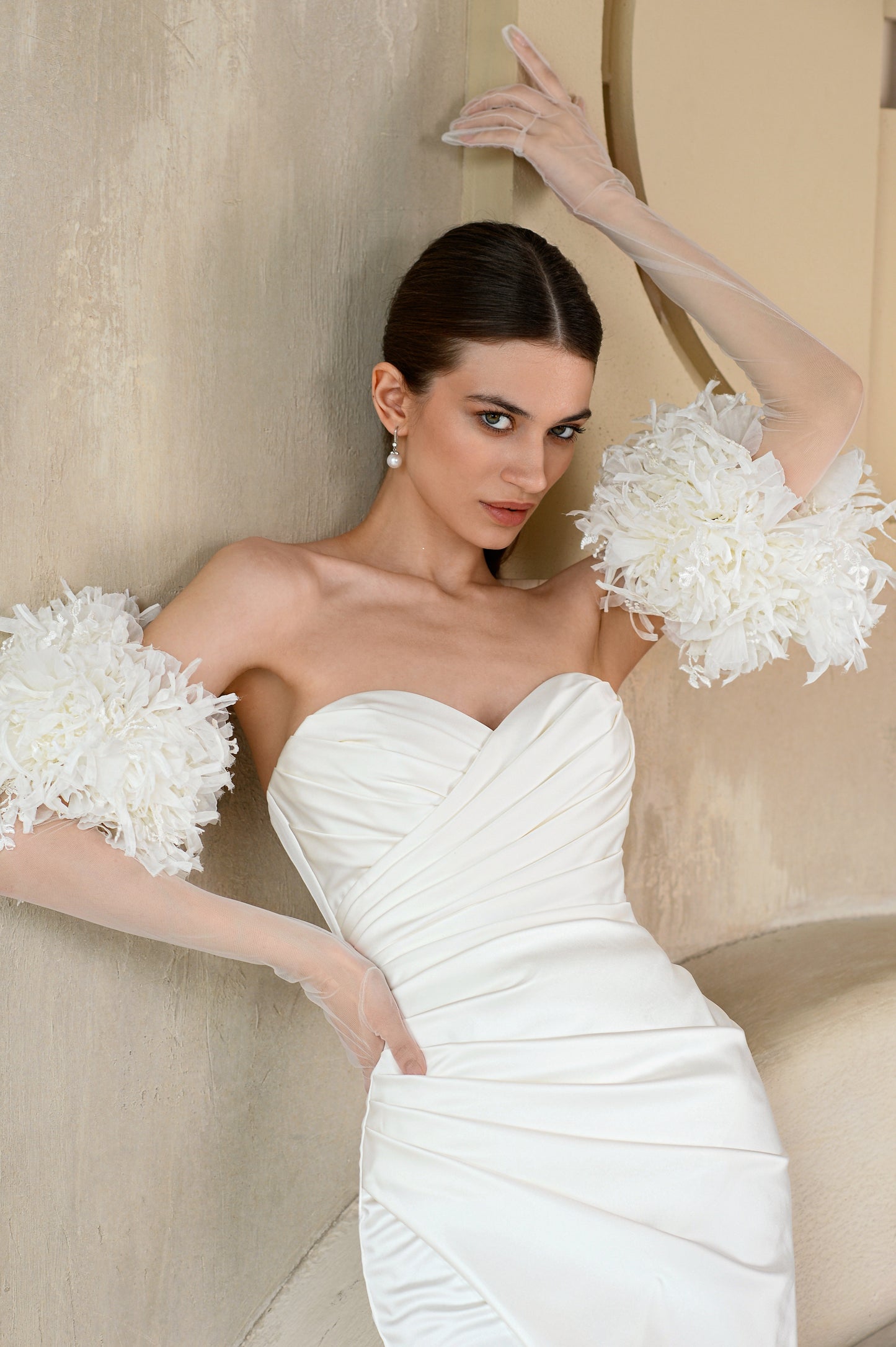 Minimalist satin wedding dress with sweetheart neckline.