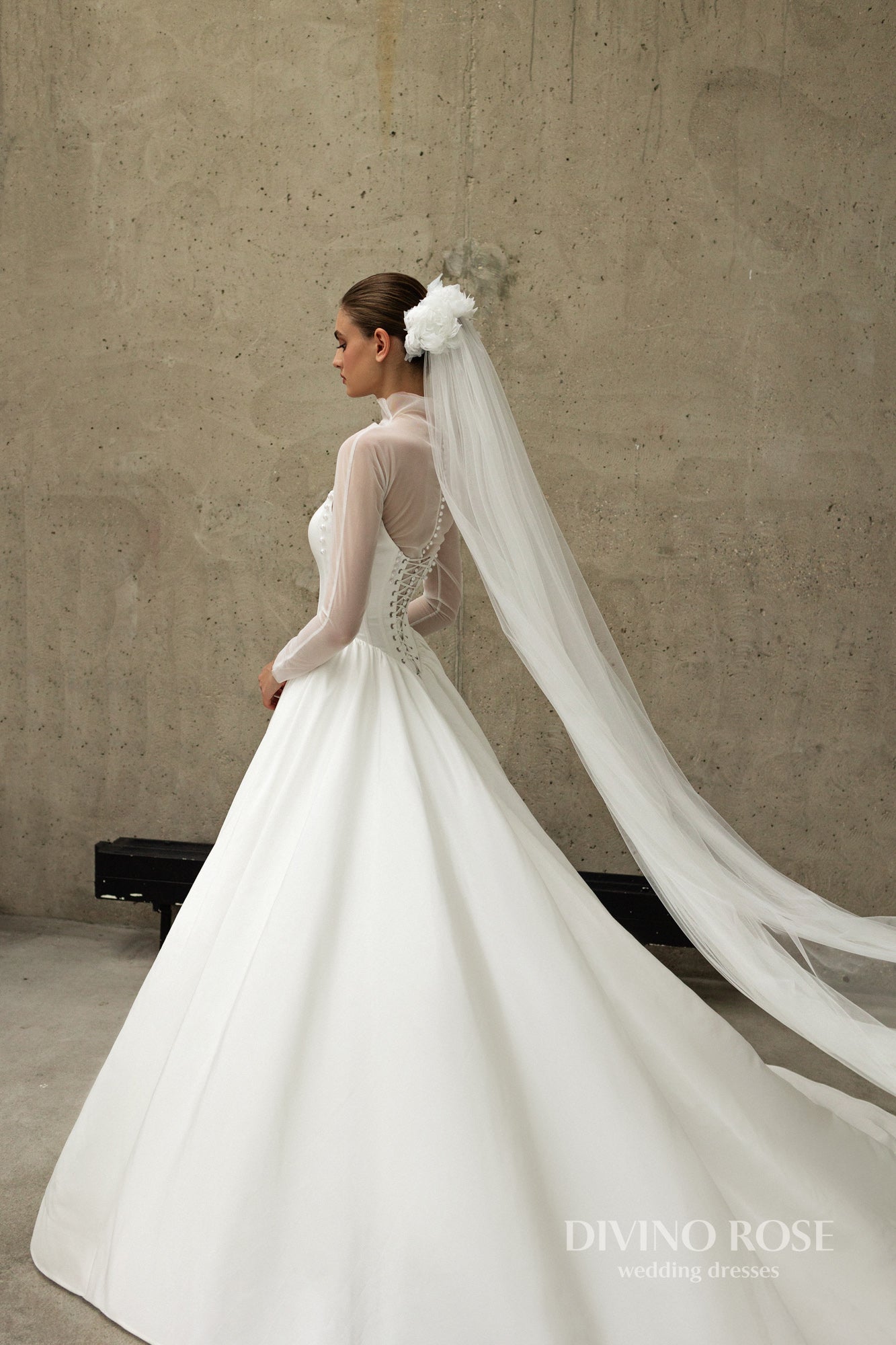 A-line wedding dress with boat neckline and corset back.