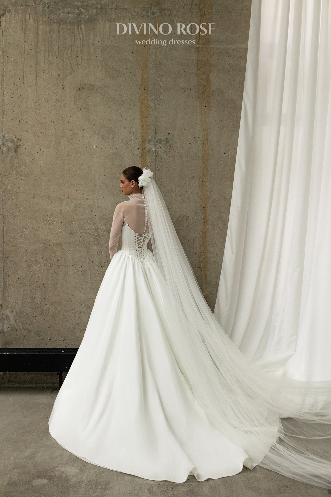 A-line wedding dress with boat neckline and corset back.
