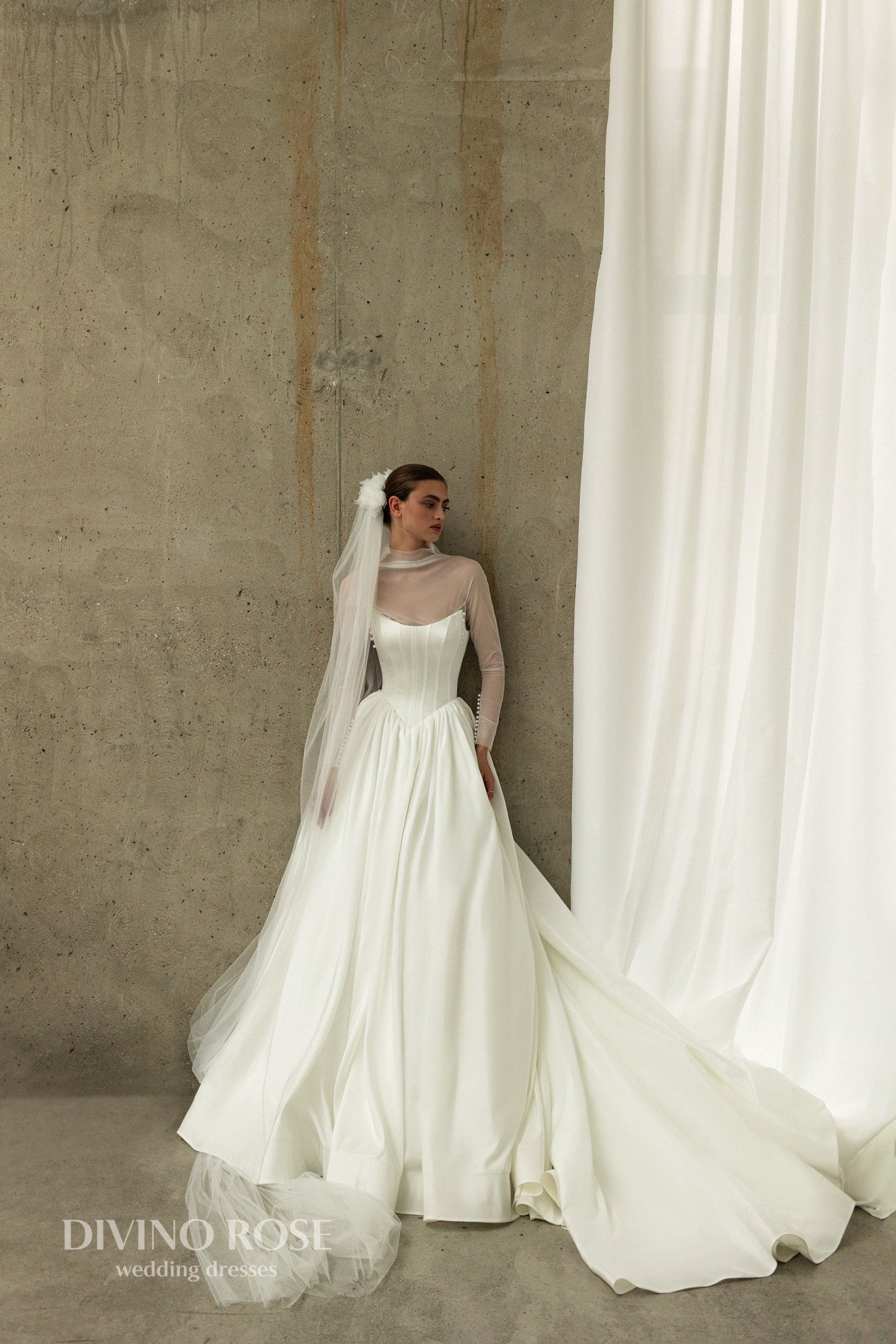 A-line wedding dress with boat neckline and corset back.