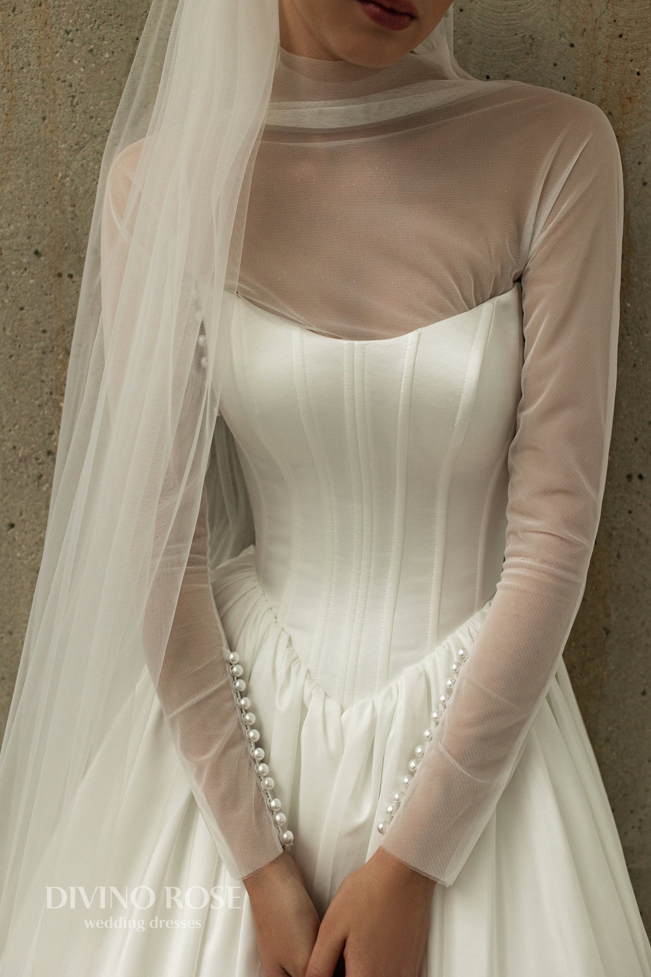 A-line wedding dress with boat neckline and corset back.