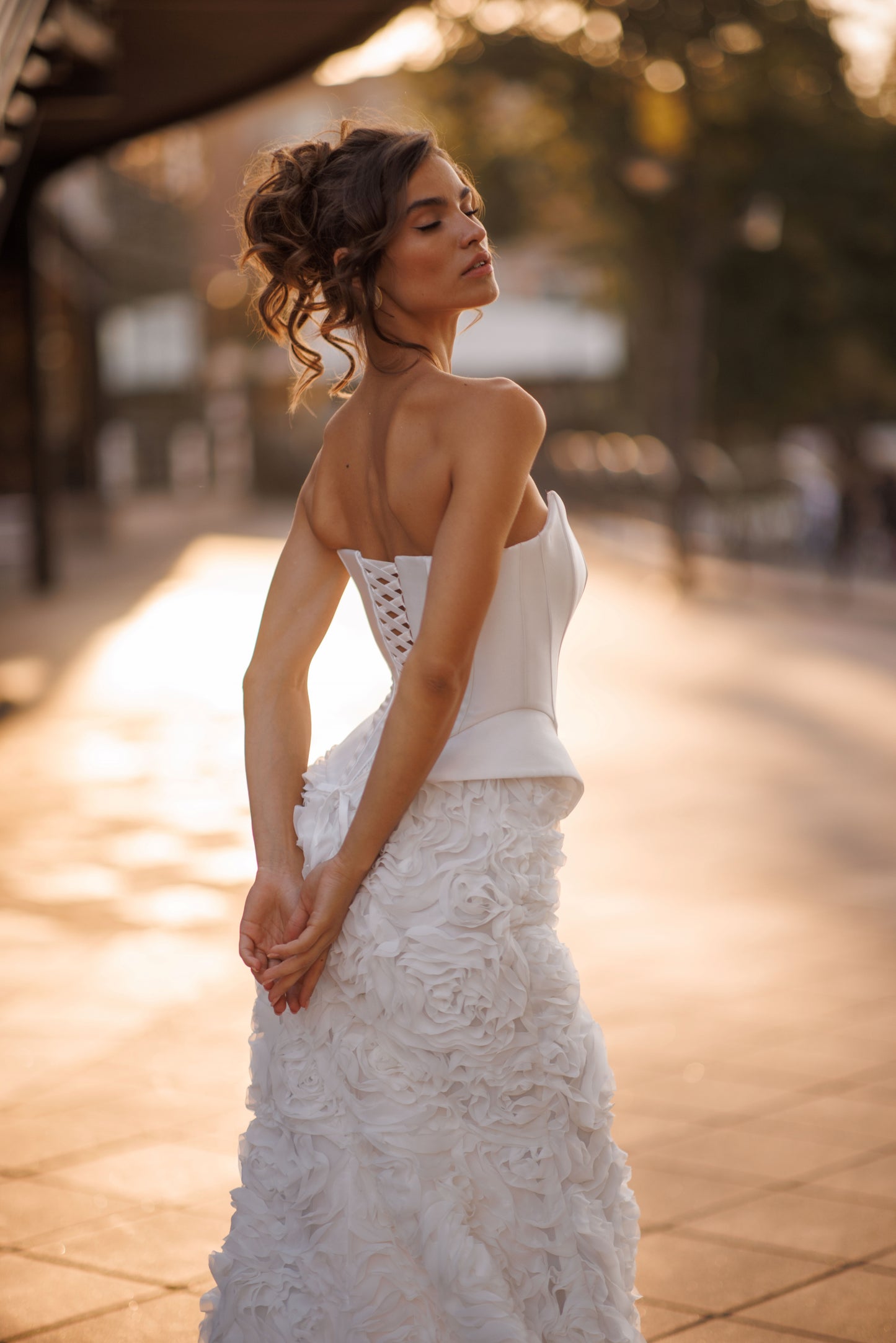 Mermaid wedding dress with boat neckline and ruffled fishtail train
