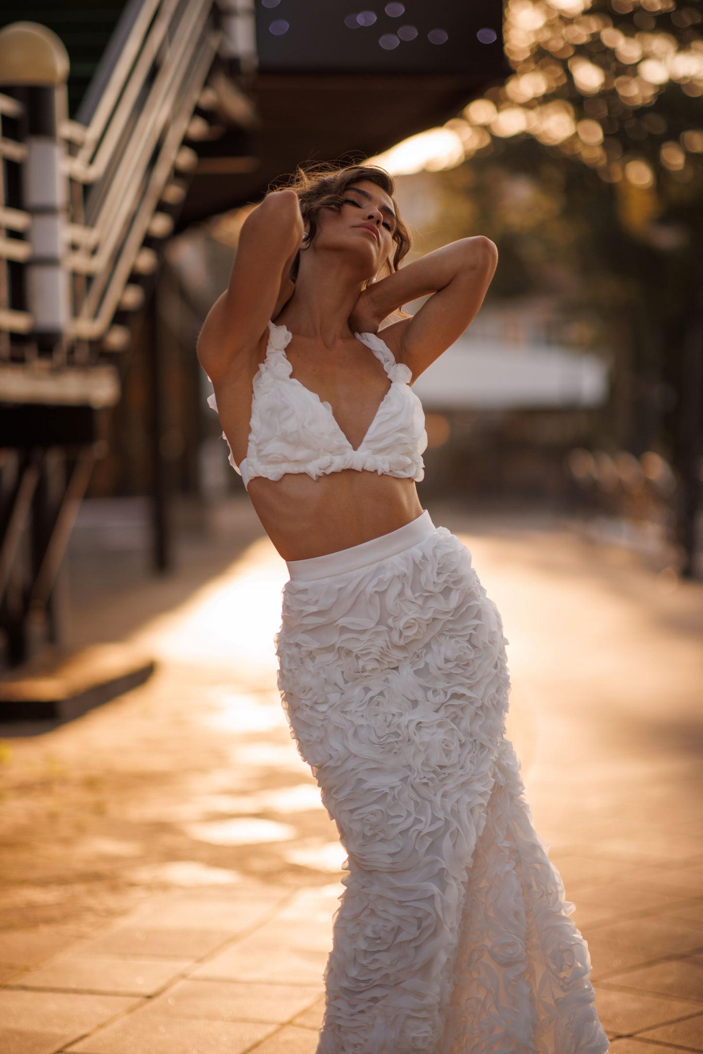 Mermaid wedding dress with boat neckline and ruffled fishtail train