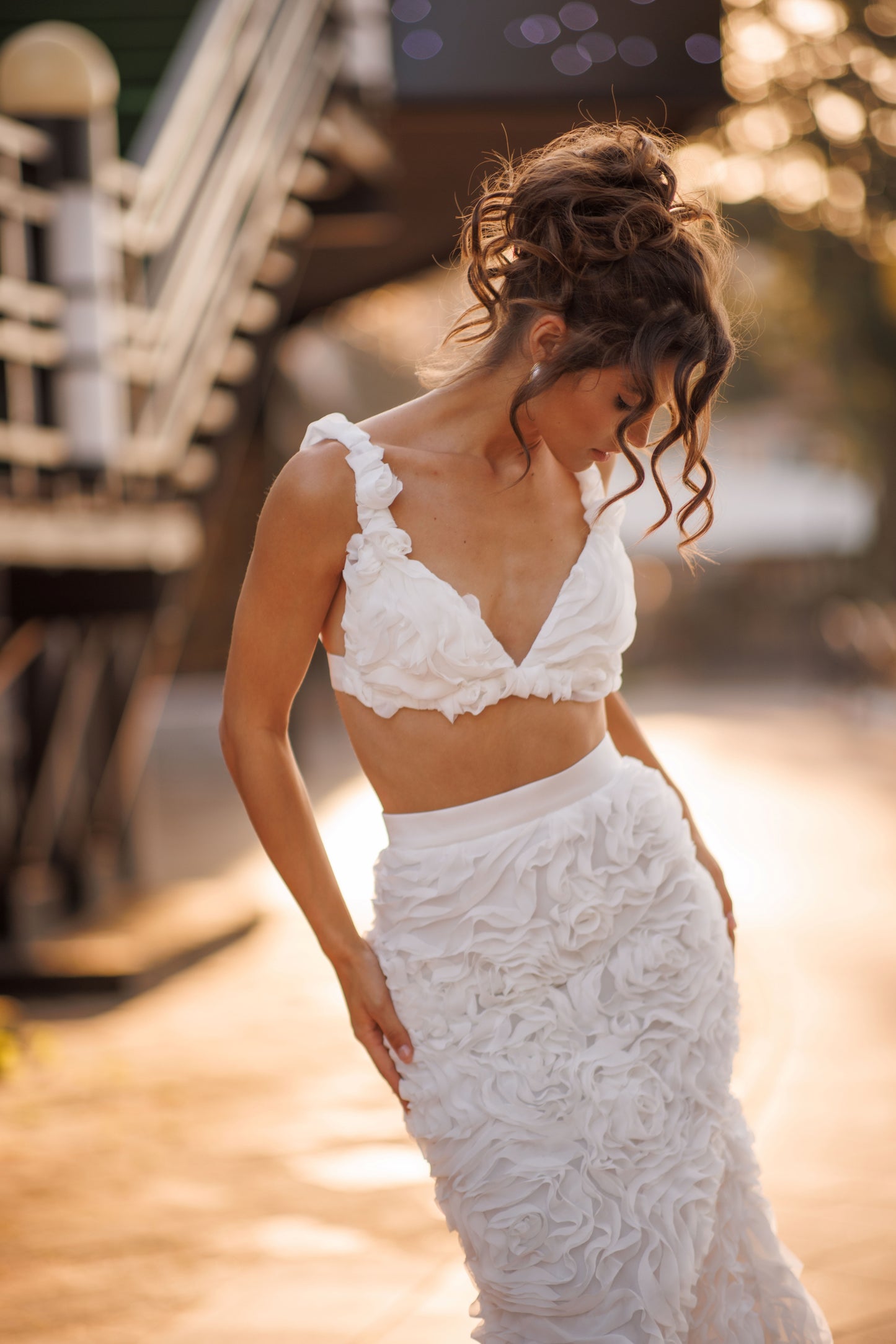 Mermaid wedding dress with boat neckline and ruffled fishtail train